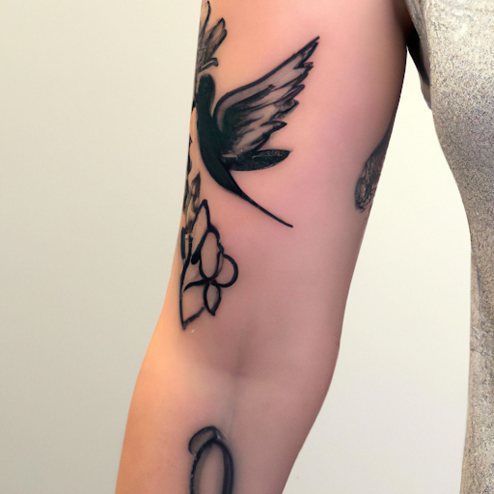 Bird tattoo on half sleeve for women