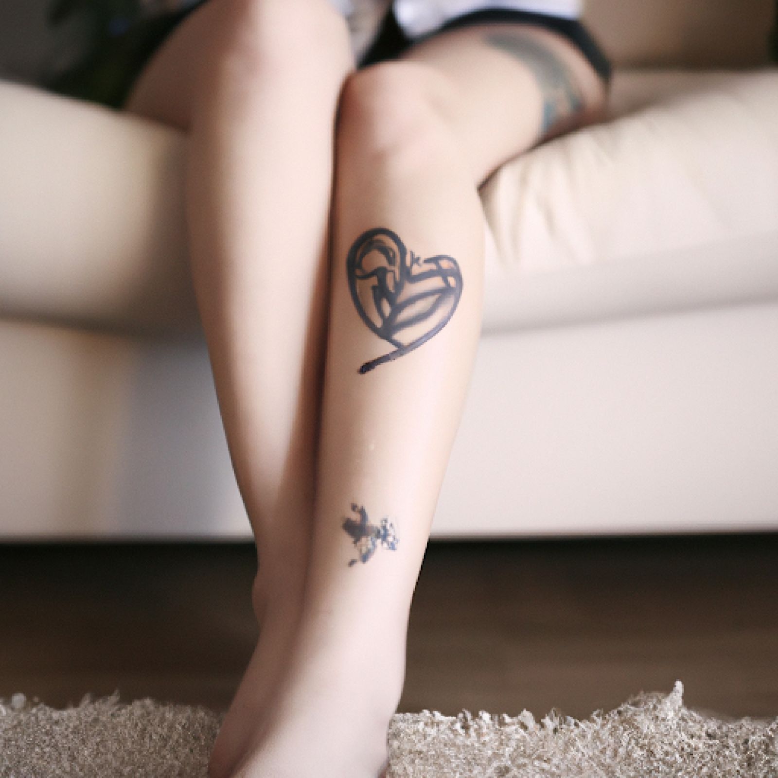 Broken heart tattoo on leg for women