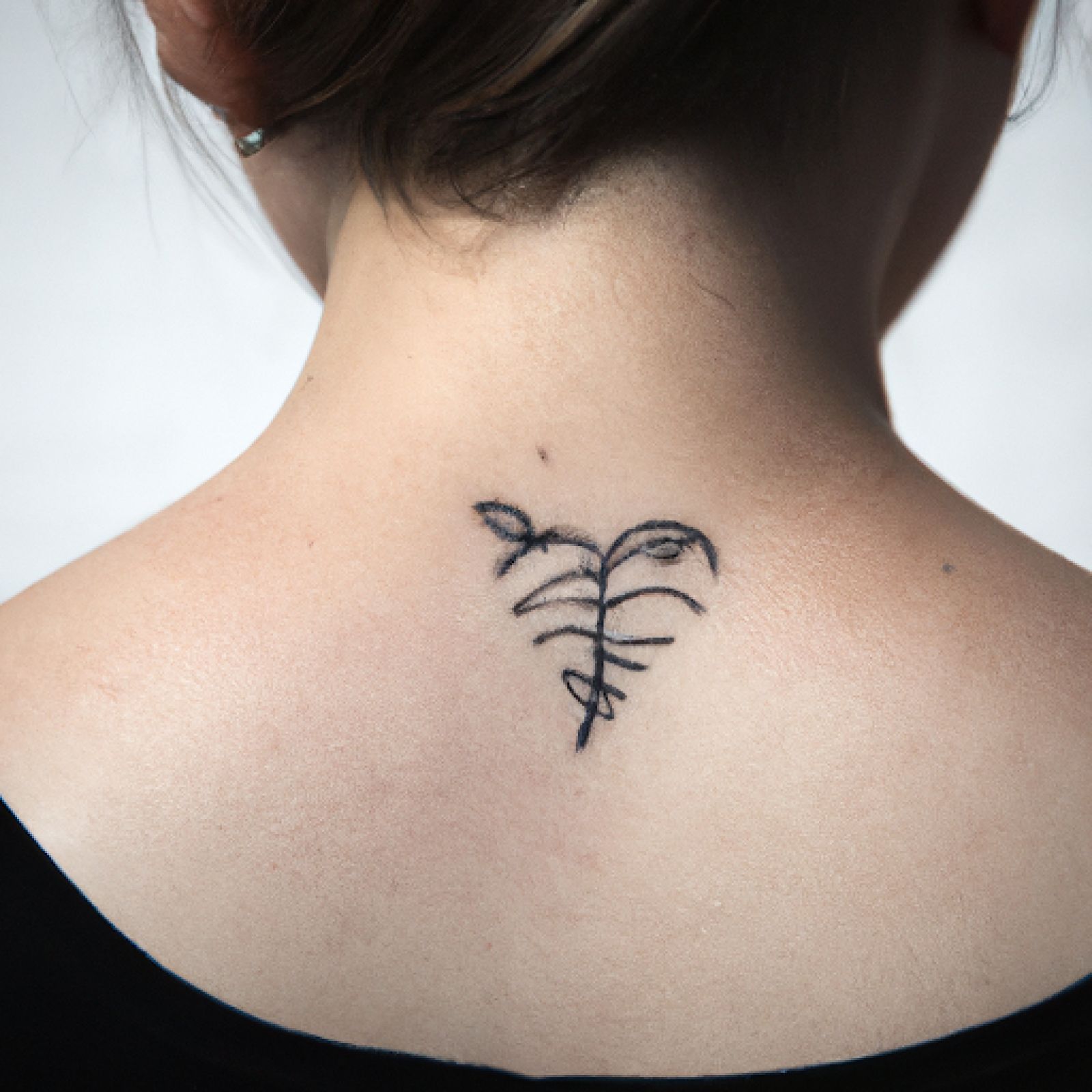 Broken heart tattoo on neck for women