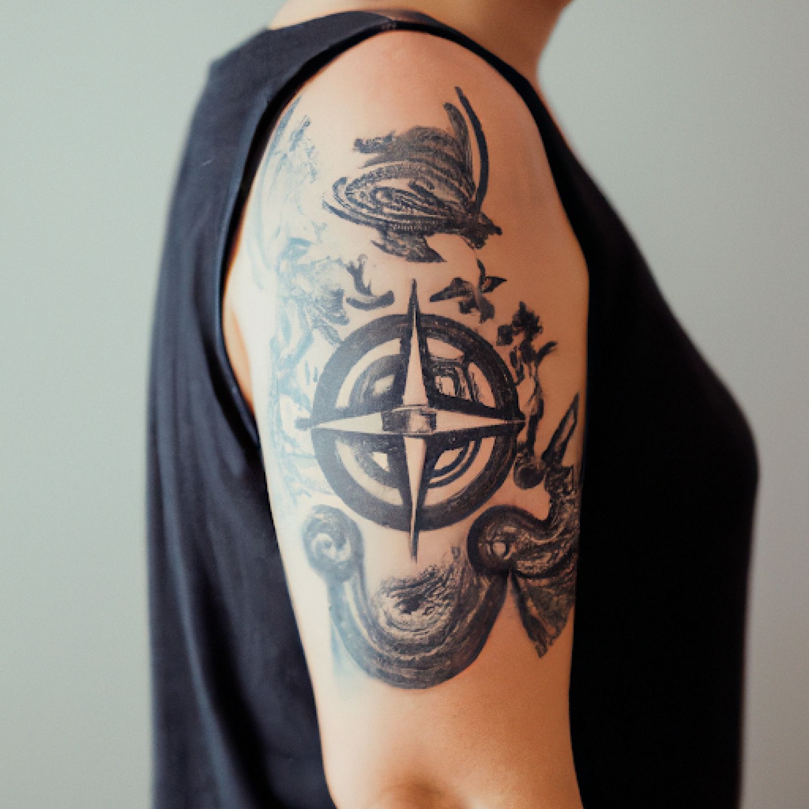 Compass tattoo on half sleeve for women