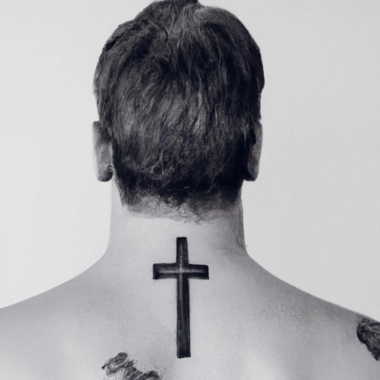 Cross tattoo on back for men