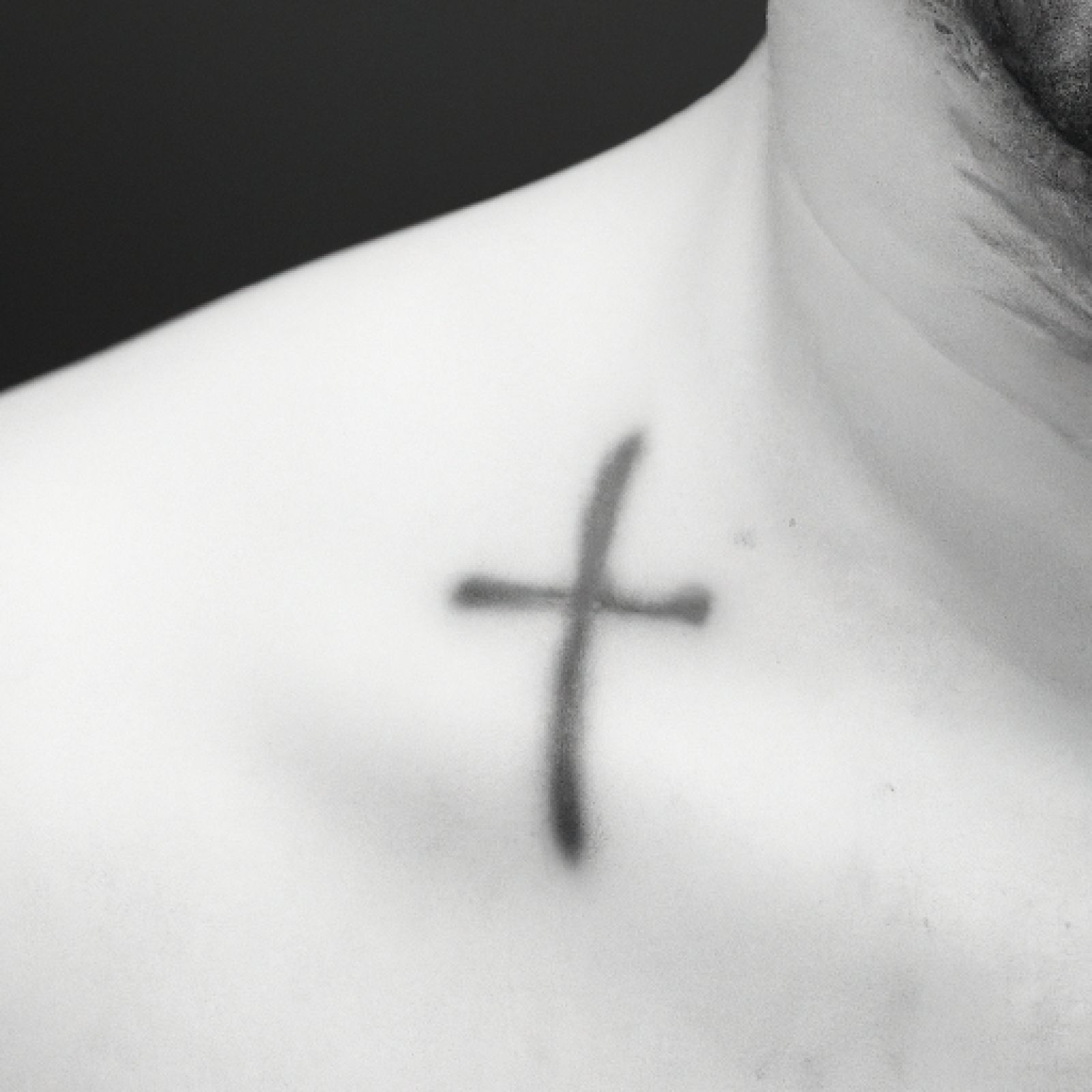 Cross tattoo on chest for men
