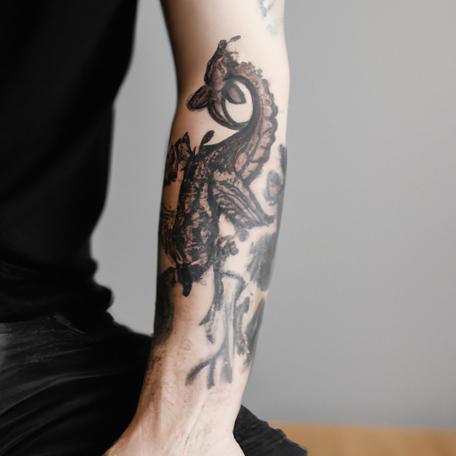 Dragon tattoo on arm for men