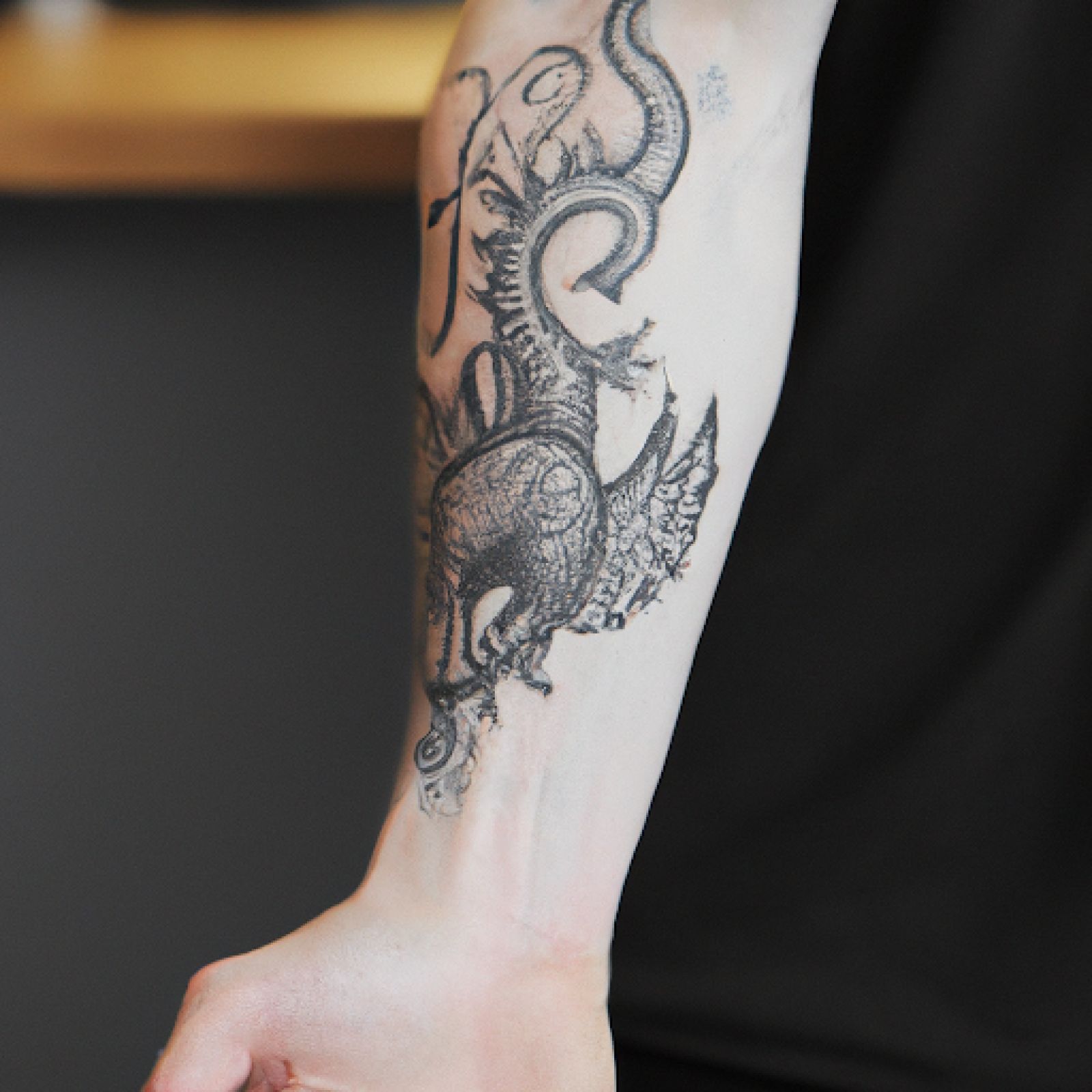 Dragon tattoo on forearm for men
