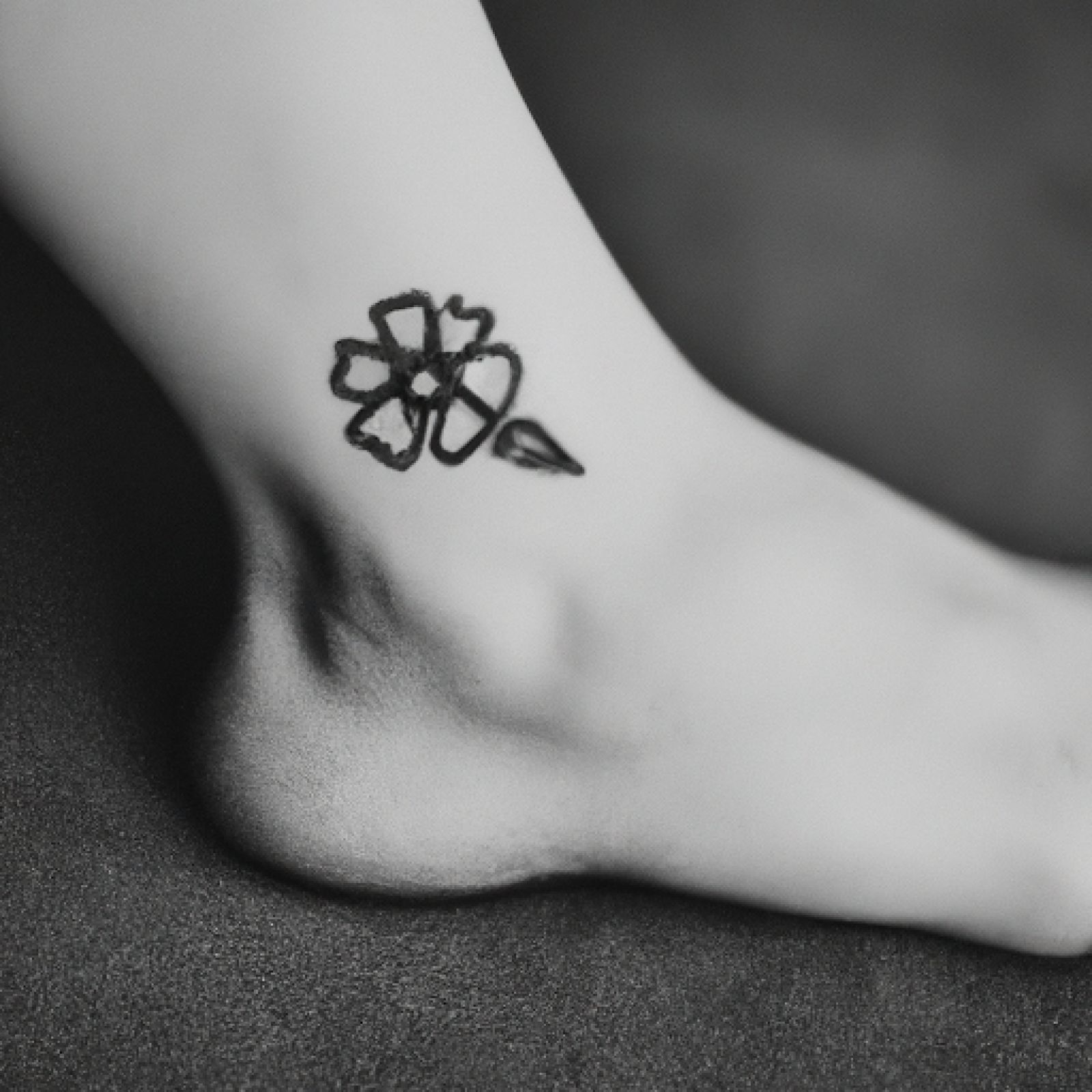 Flower tattoo on foot for women