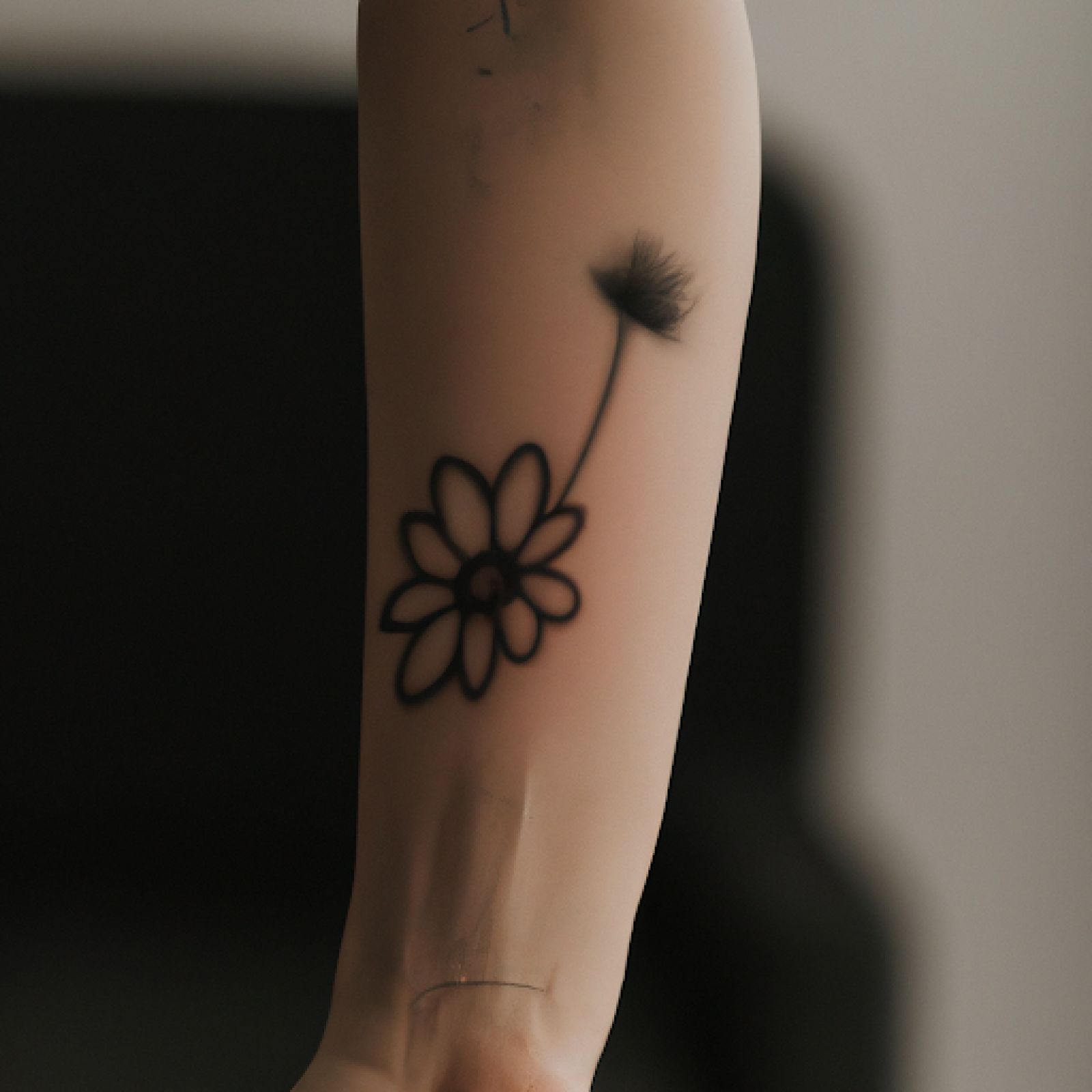 Flower tattoo on forearm for women