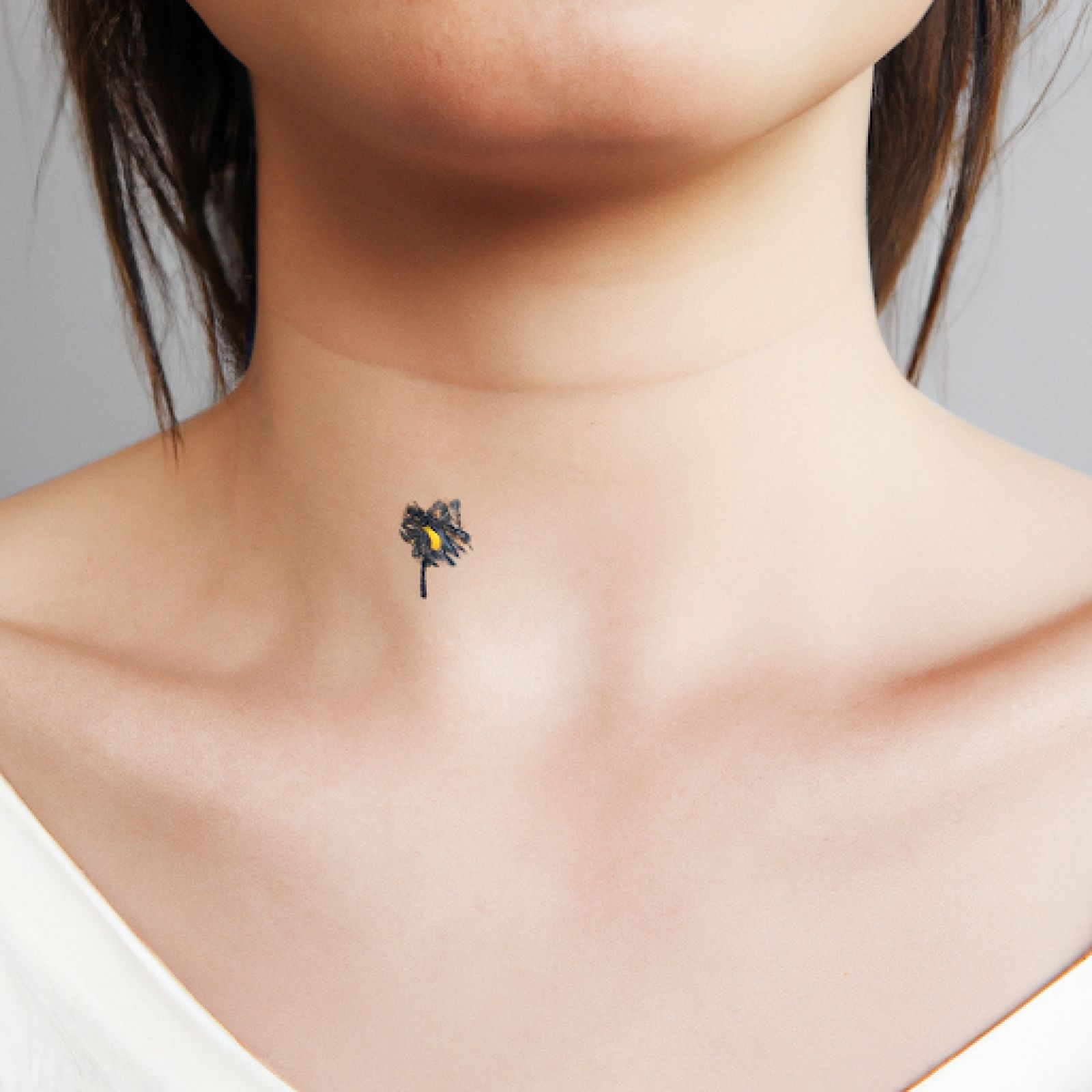 Flower tattoo on neck for women