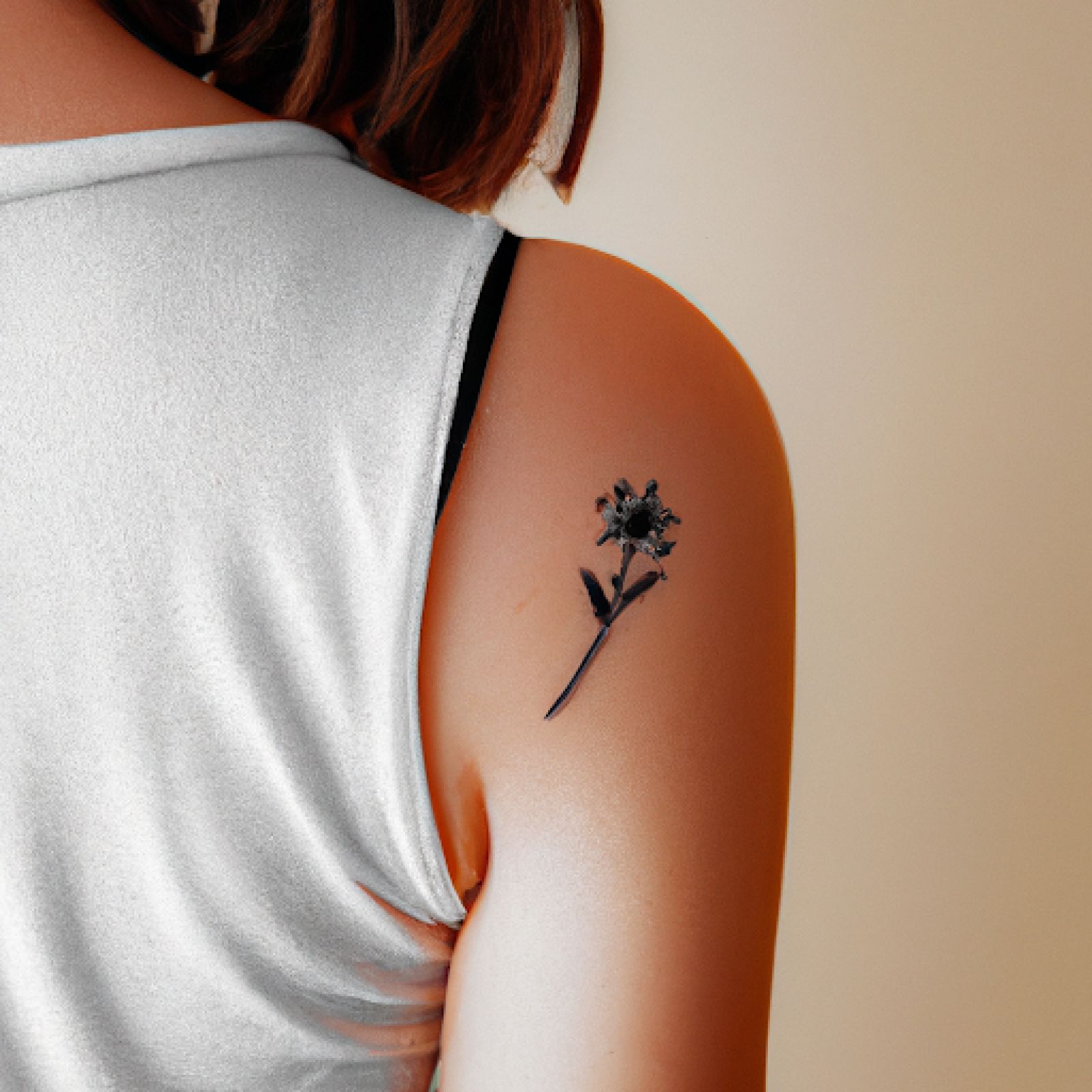 Flower tattoo on side for women