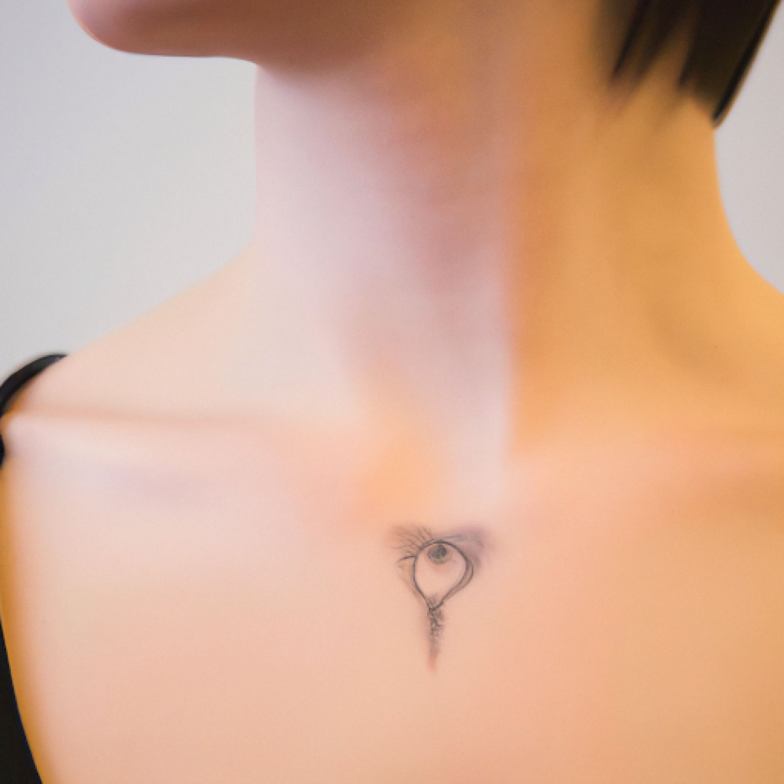 Heart tattoo on neck for women
