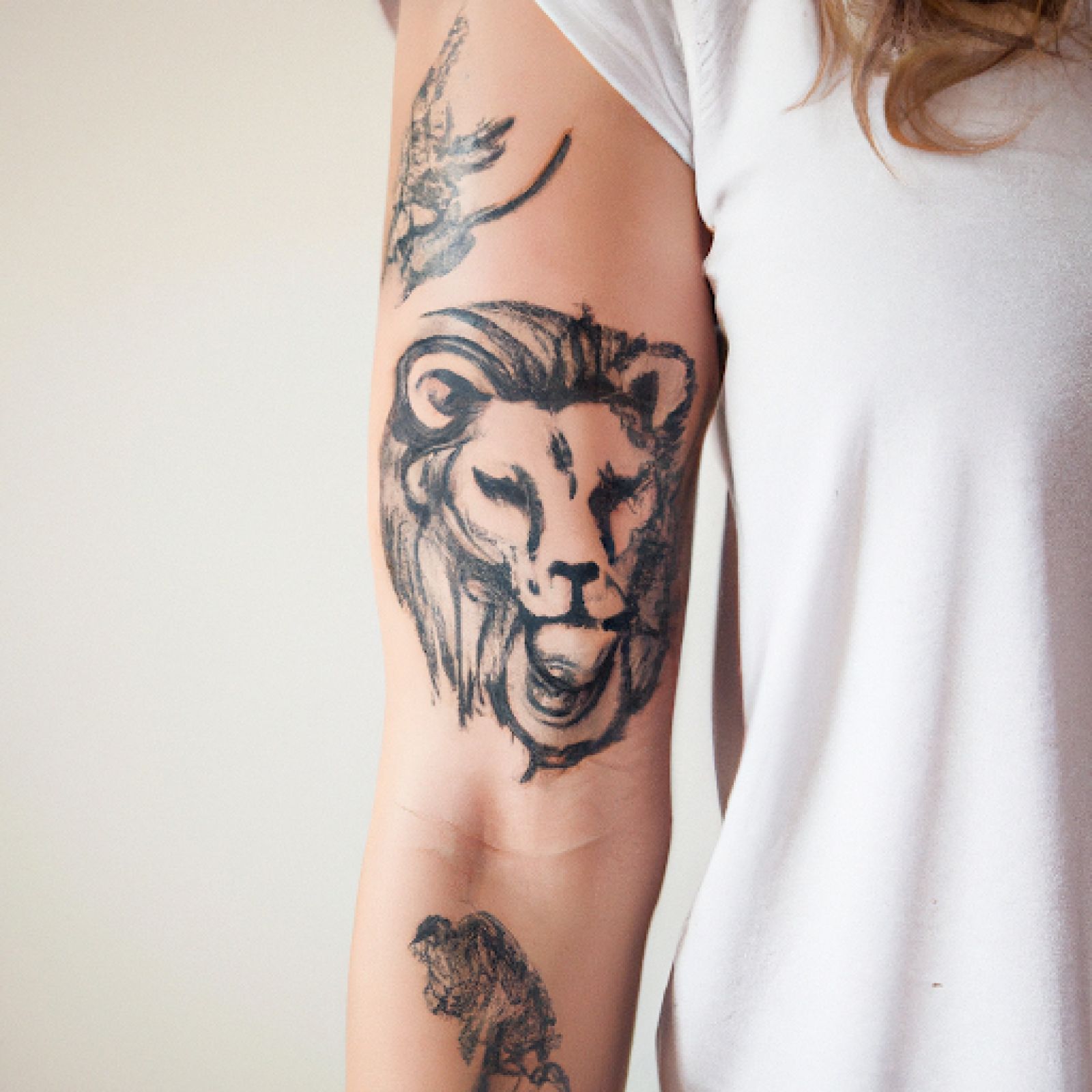 Lion tattoo on half sleeve for women