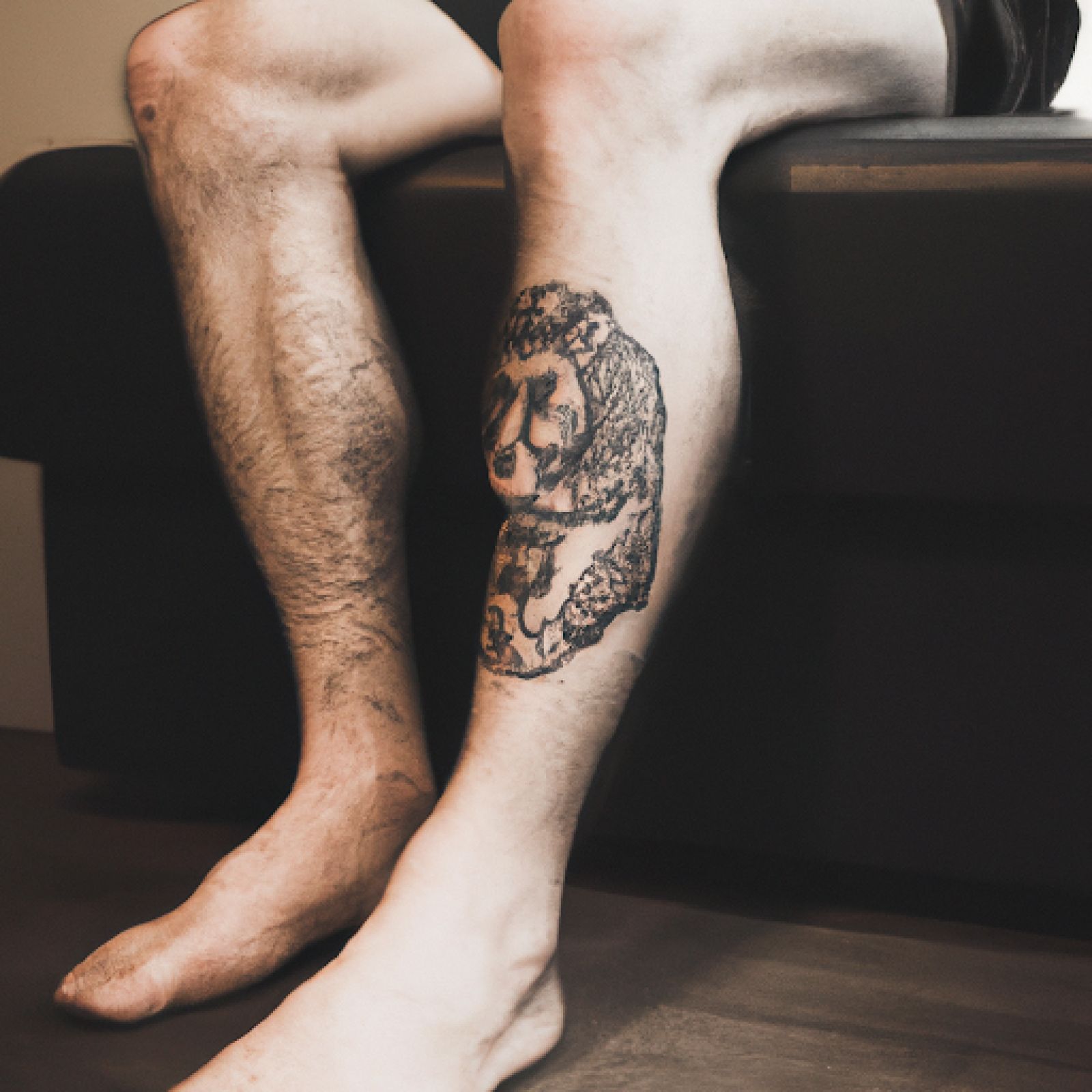 Lion tattoo on knee for men