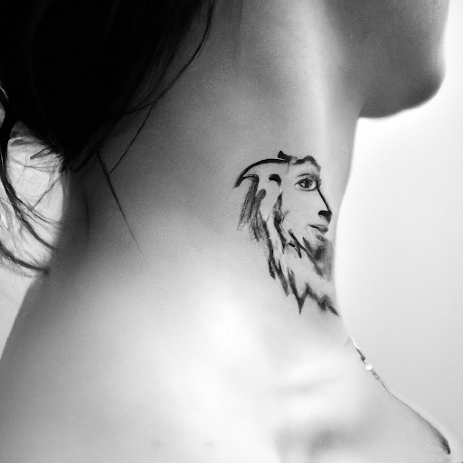 Lion tattoo on neck for women