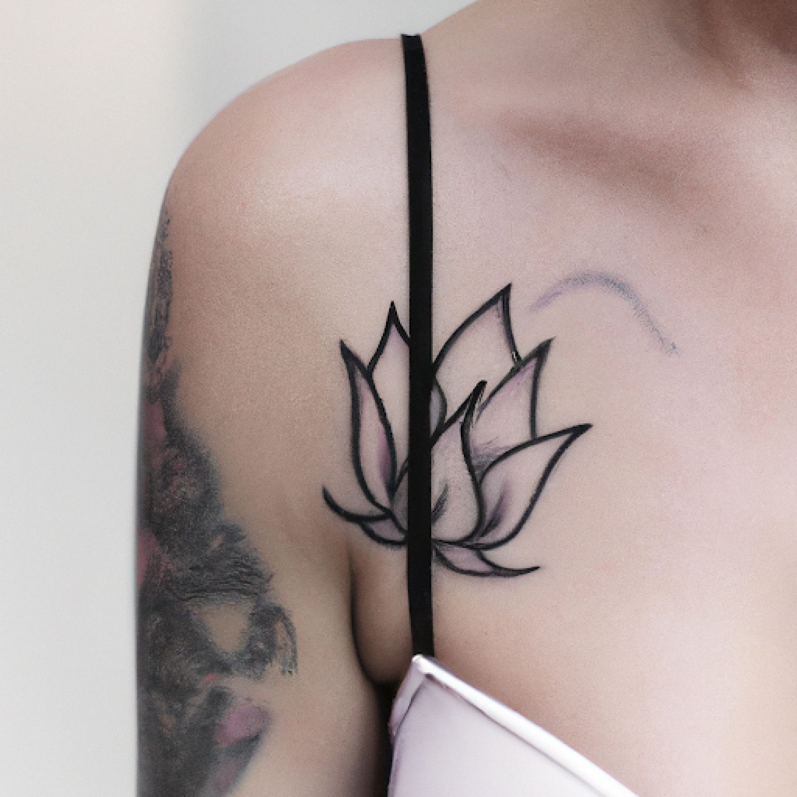 Lotus tattoo on chest for women
