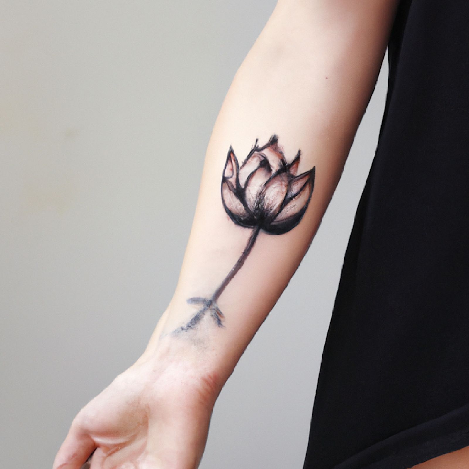 Lotus tattoo on hand for women