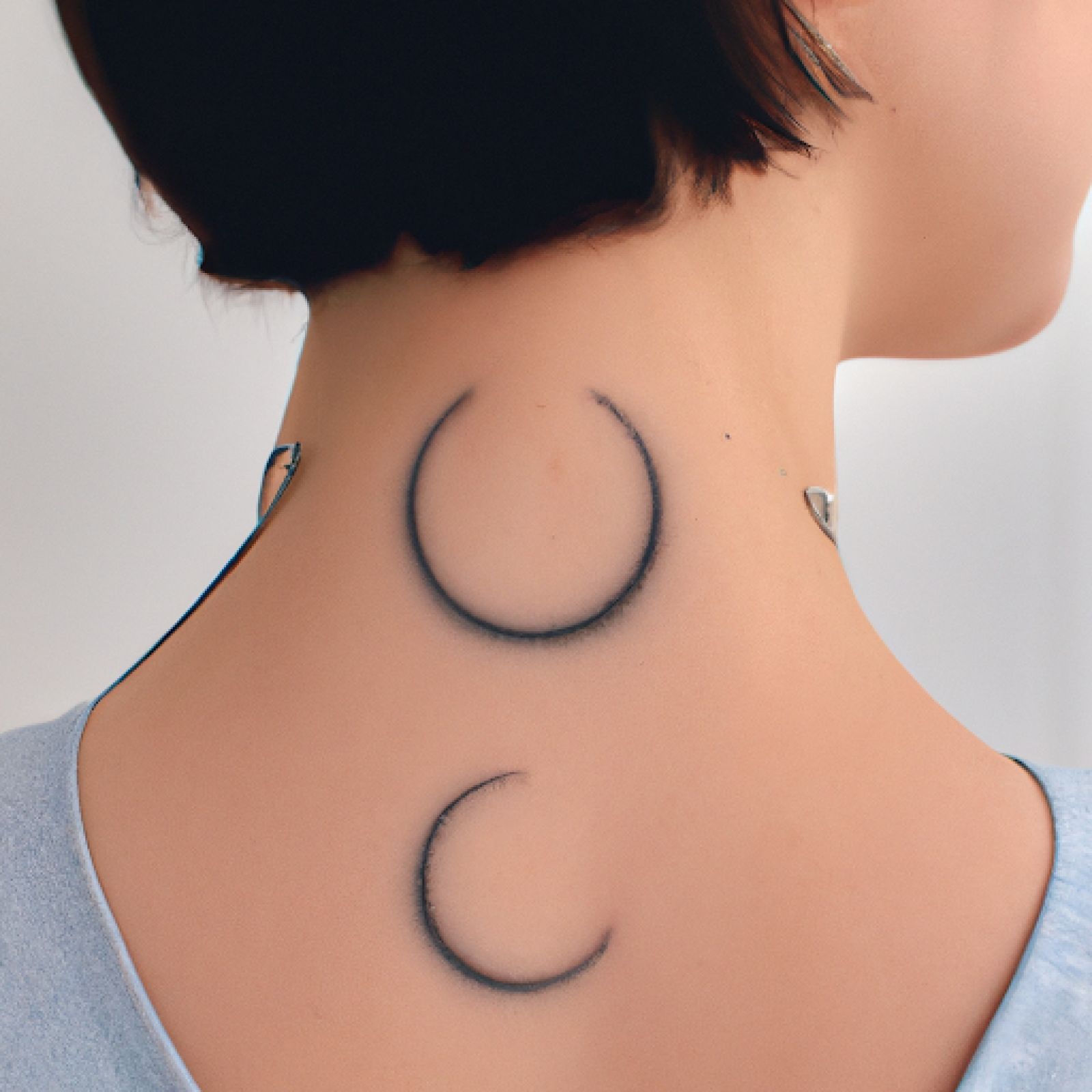 Moon phases tattoo on neck for women