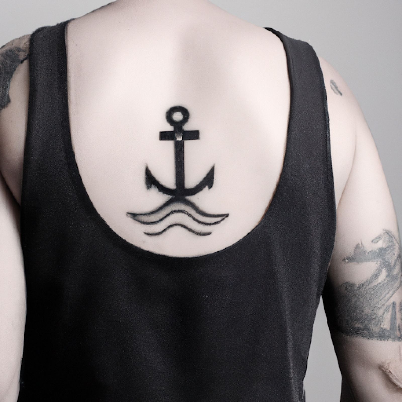 Ship tattoo on back for men