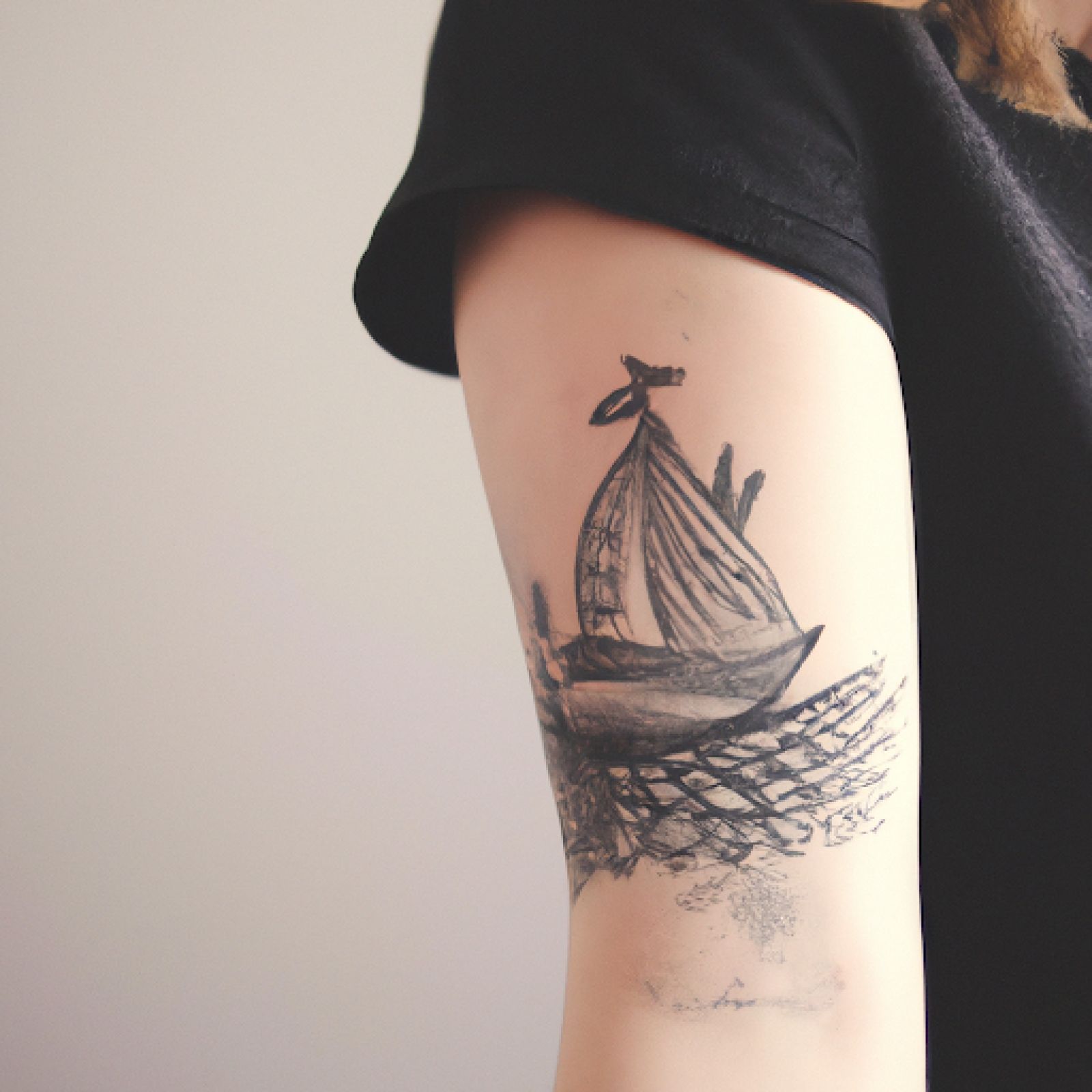 Ship tattoo on half sleeve for women