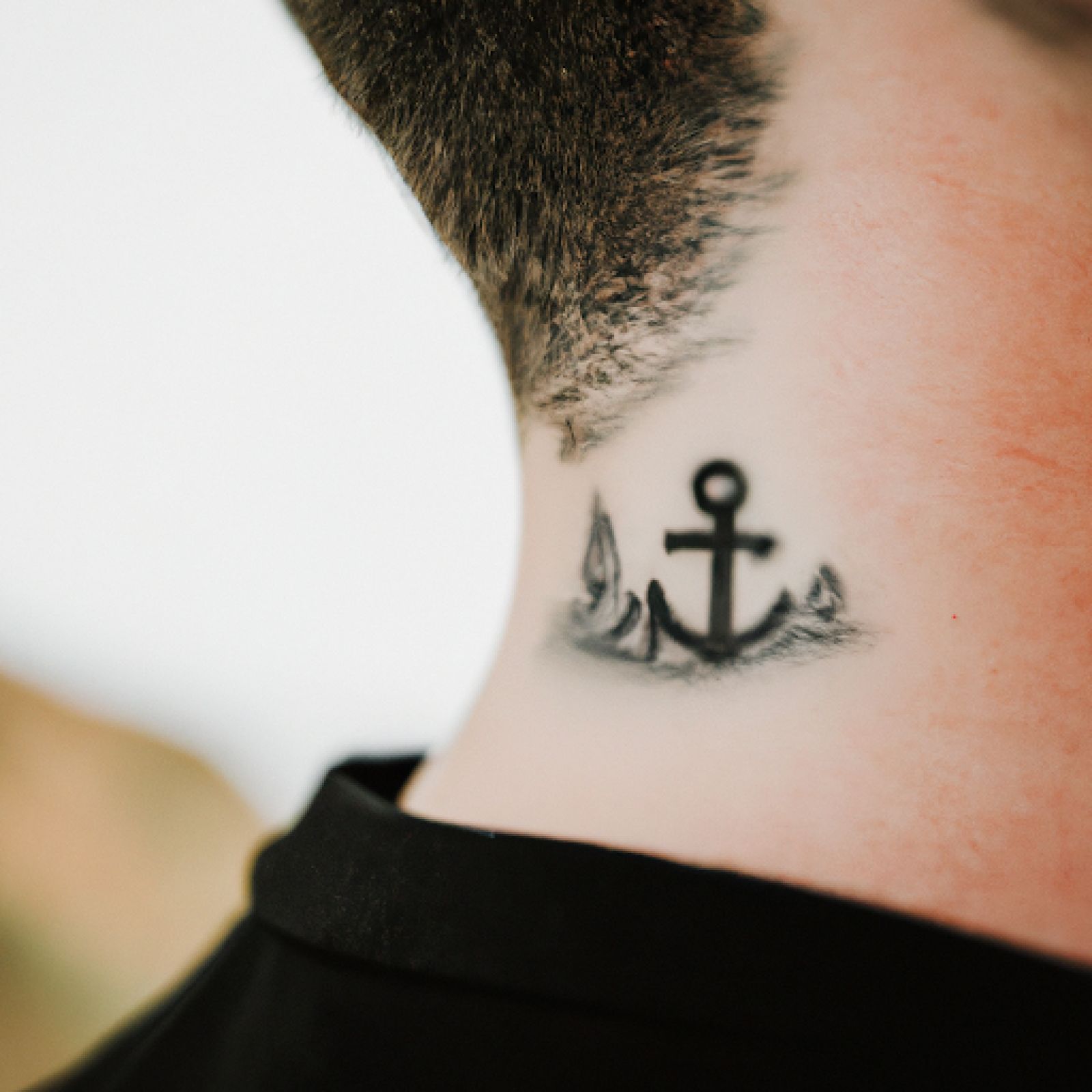 Ship tattoo on neck for men