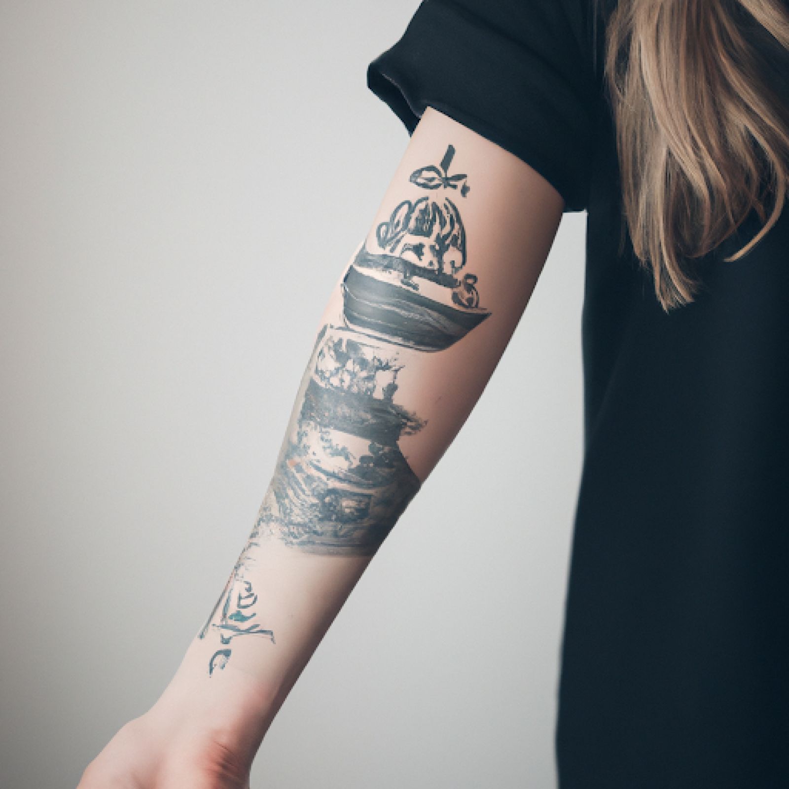 Ship tattoo on sleeve for women