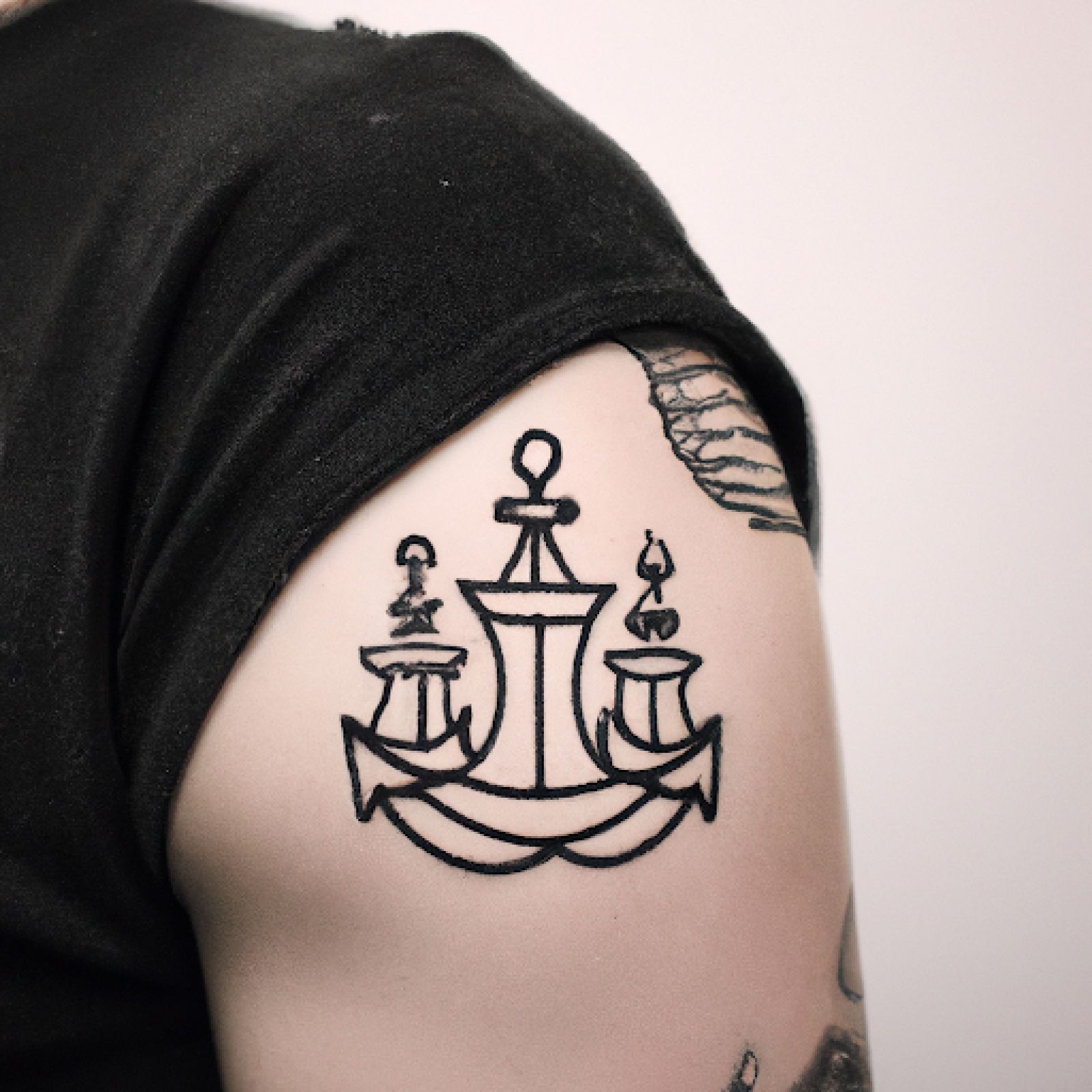 Ship tattoo on sternum for men