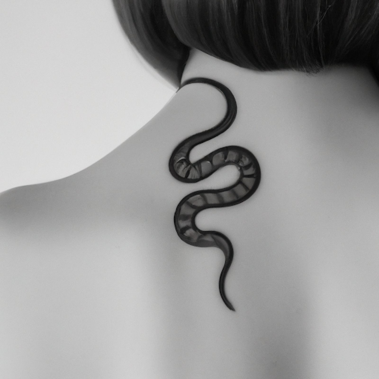 Snake tattoo on back for women