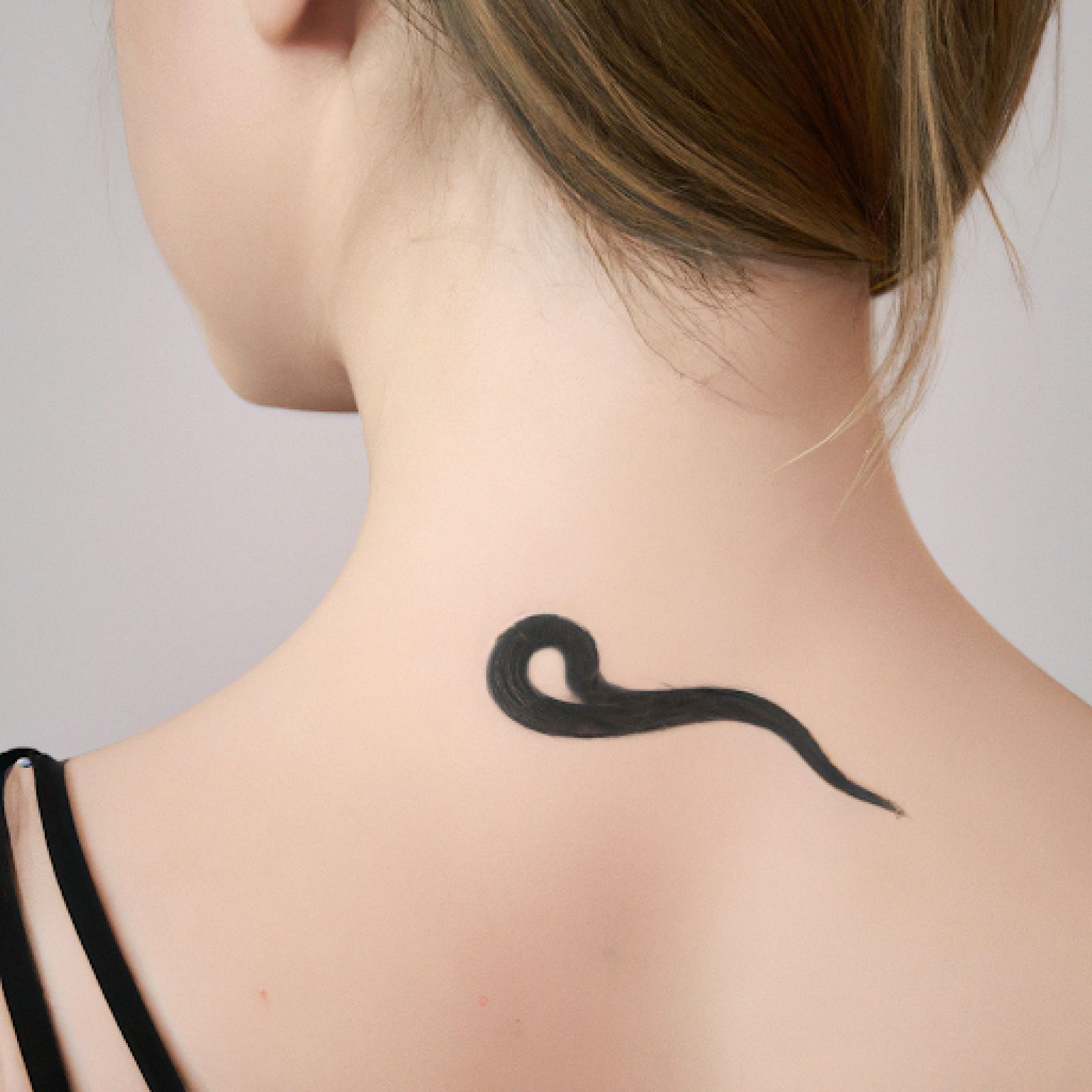 Snake tattoo on neck for women