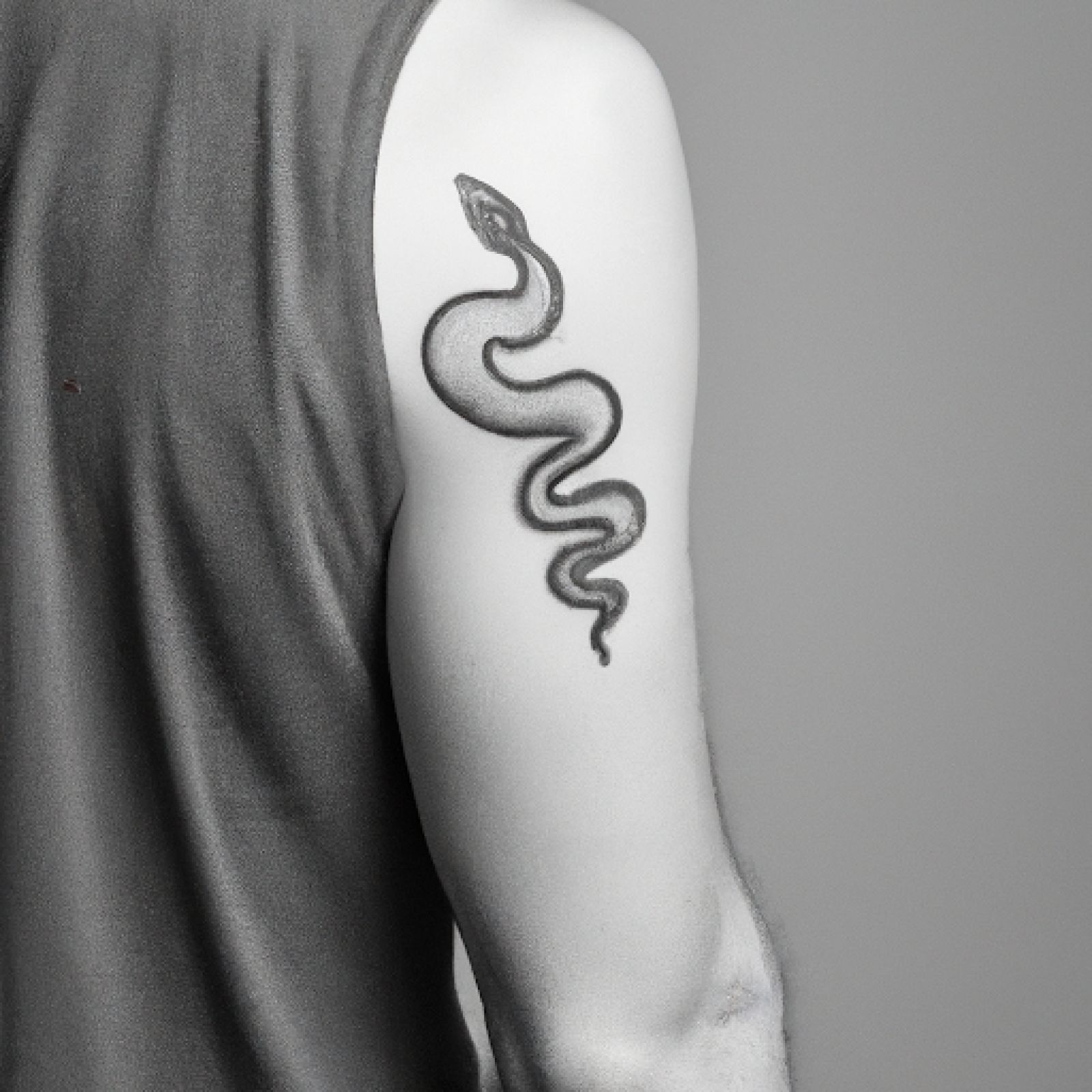 Snake tattoo on shoulder for men