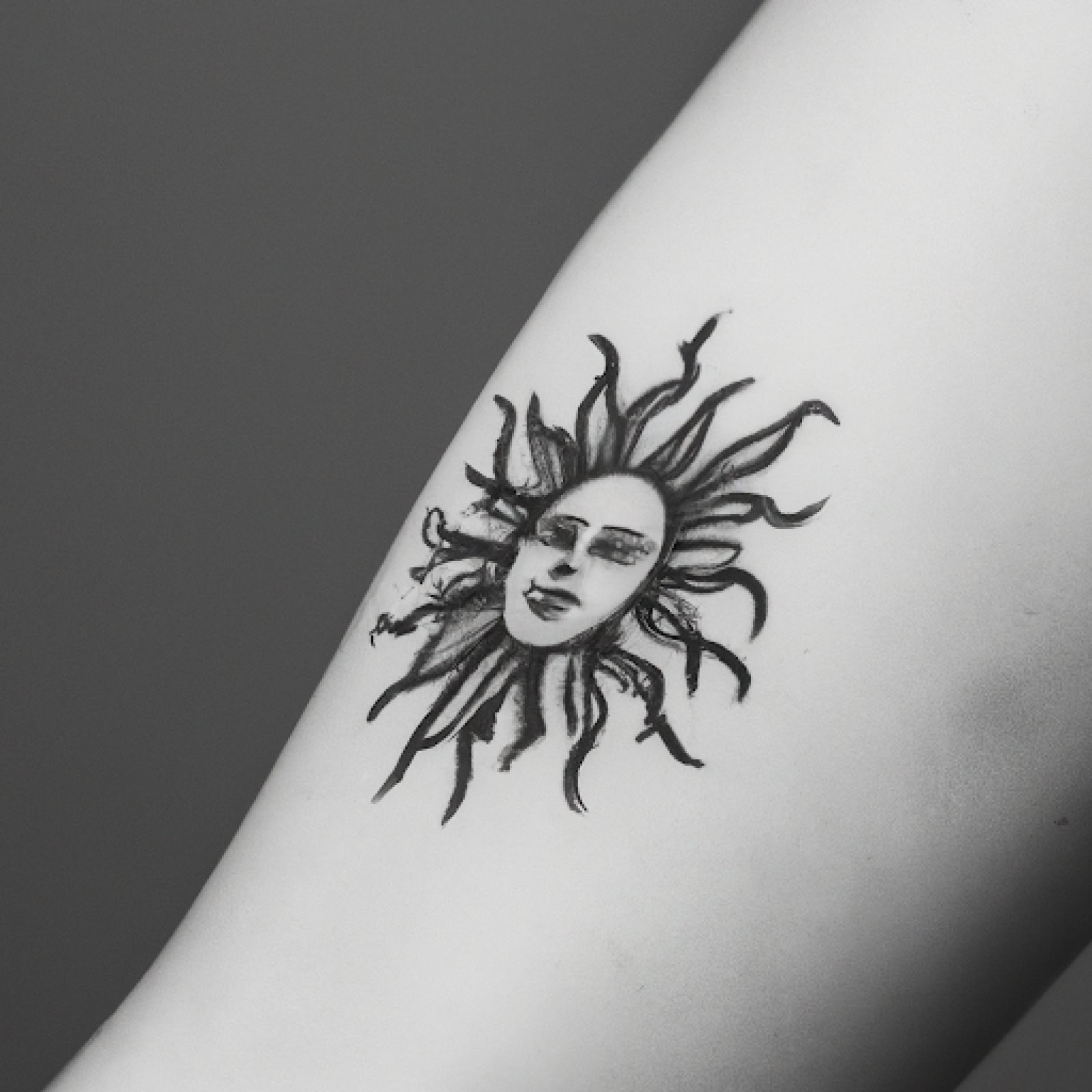 Sun tattoo on side for men