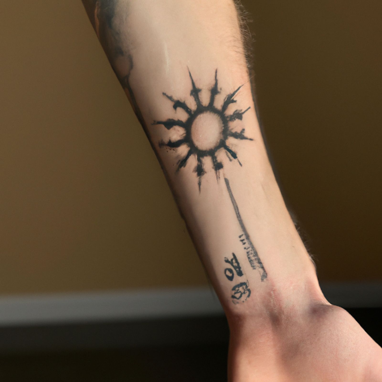 Sun tattoo on sleeve for men