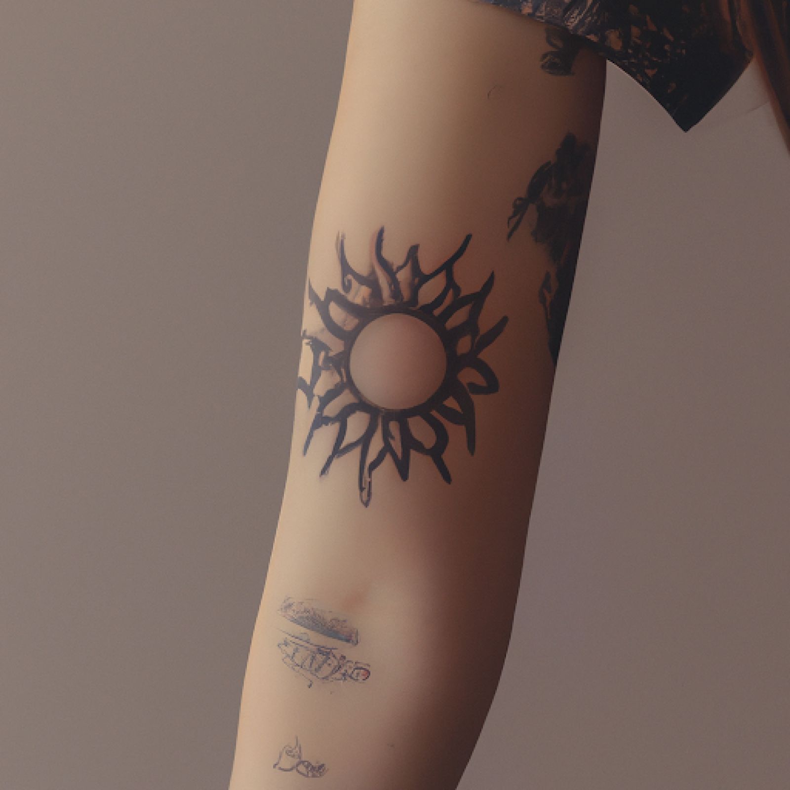 Sun tattoo on sleeve for women