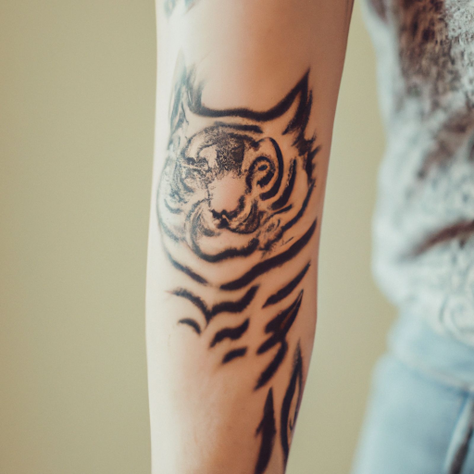 Tiger tattoo on arm for women