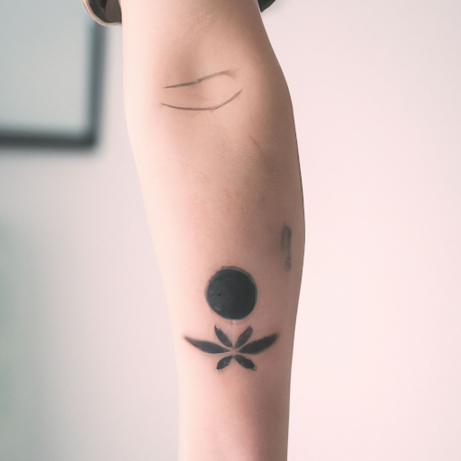 Trash polka tattoo on arm for women