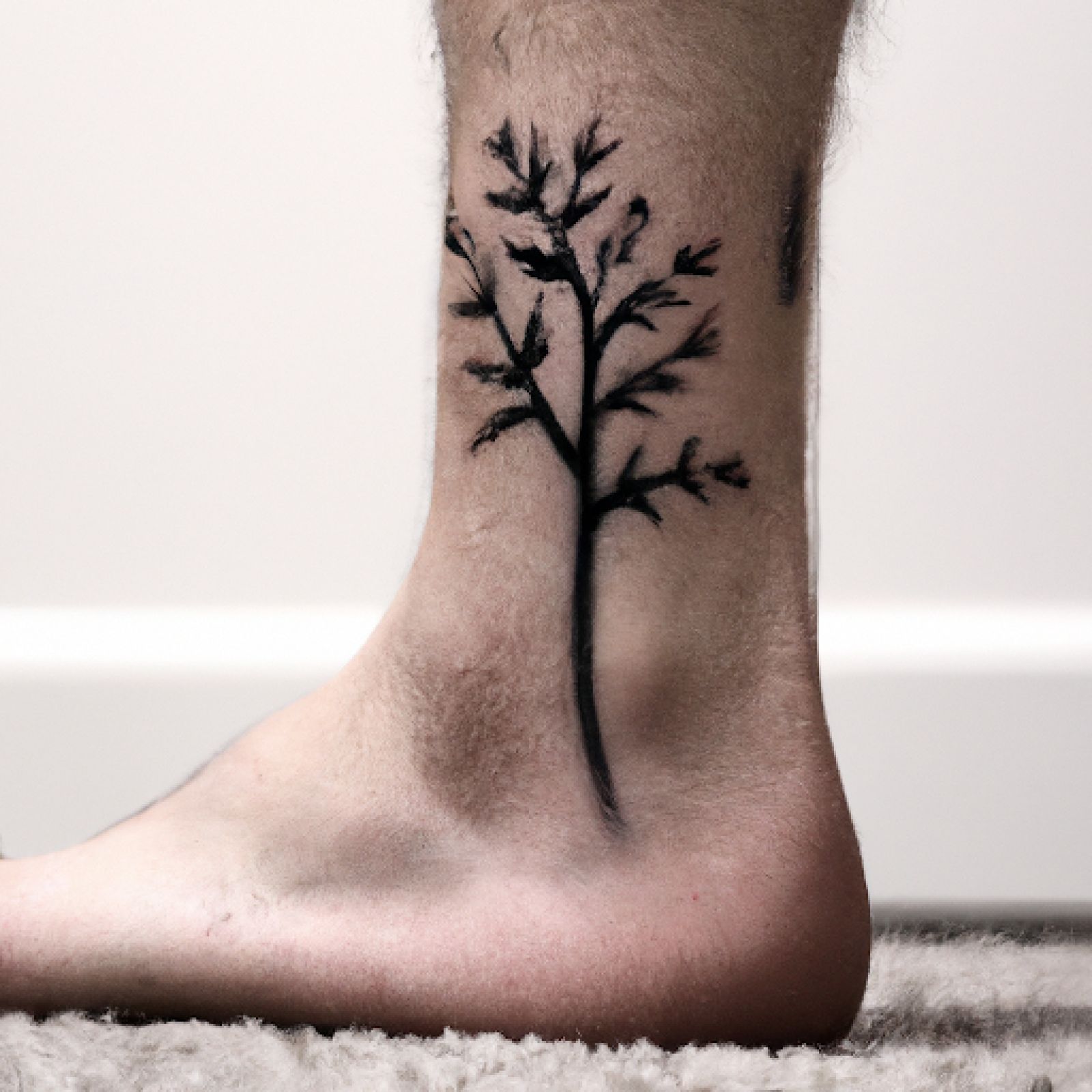 Tree of life tattoo on foot for men