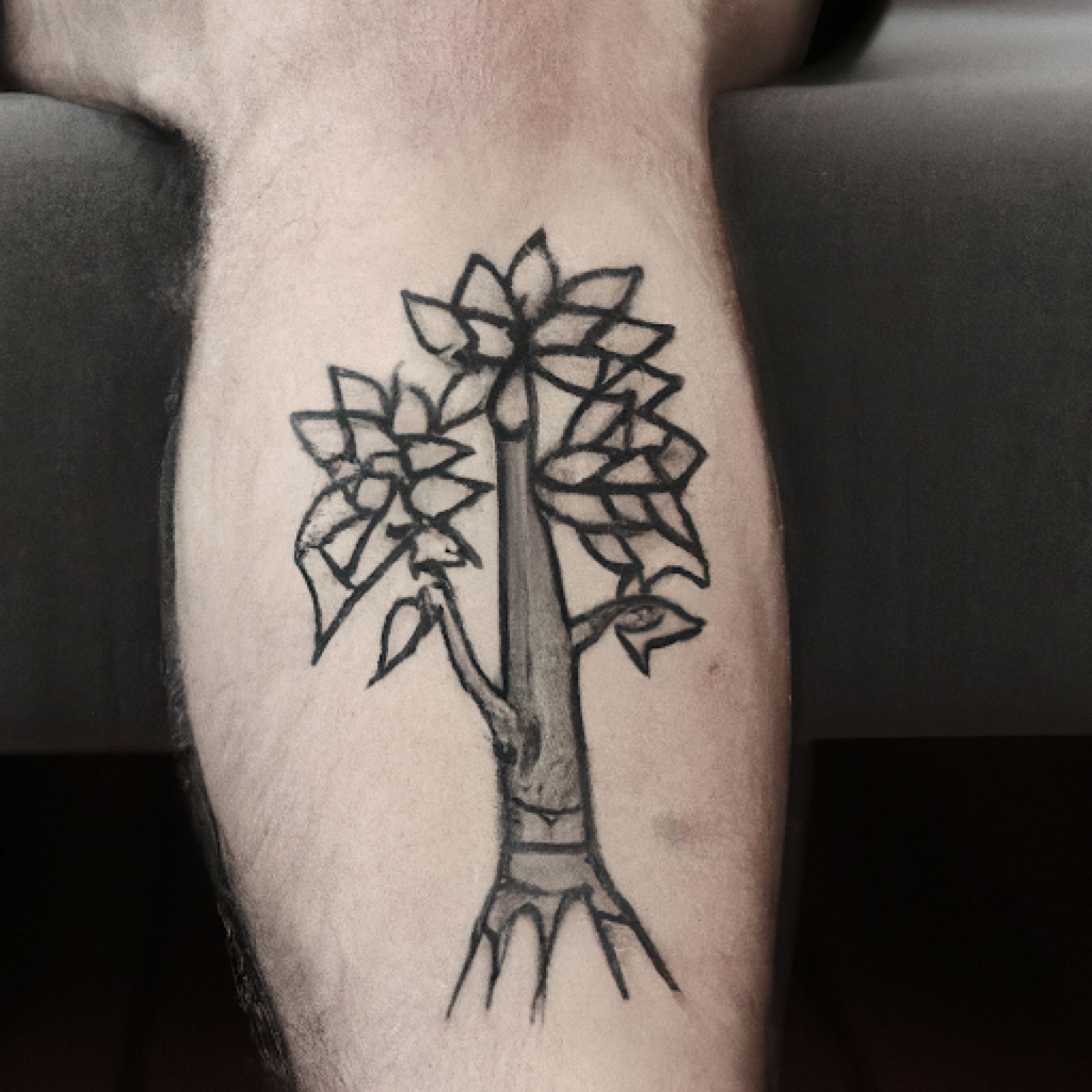 Tree of life tattoo on knee for men