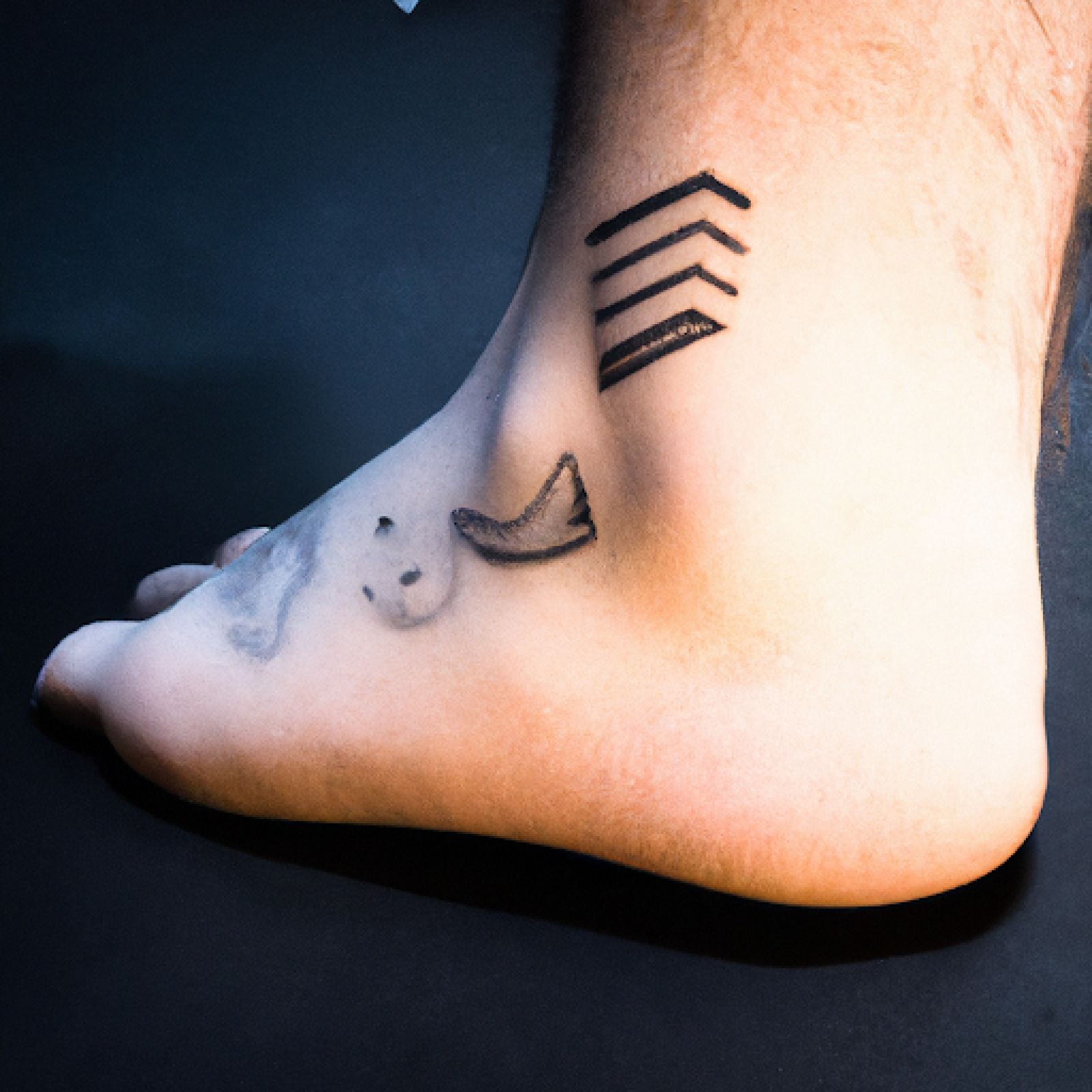 Watercolor tattoo on foot for men