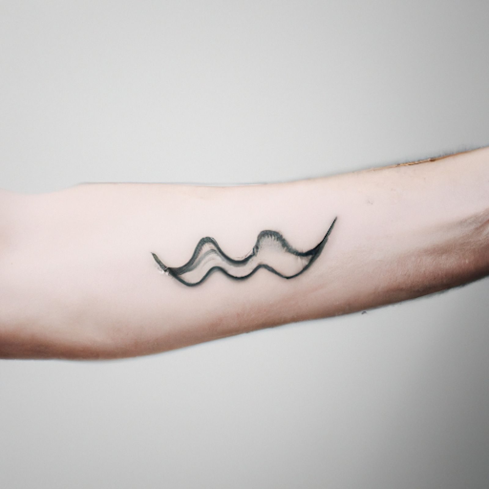 Wave tattoo on back for men