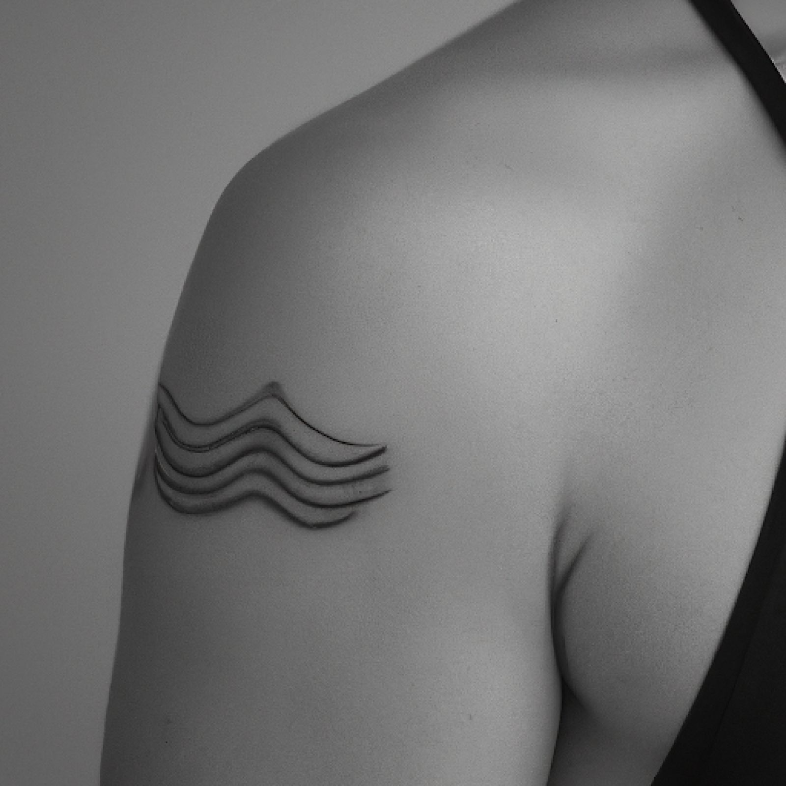 Wave tattoo on chest for men