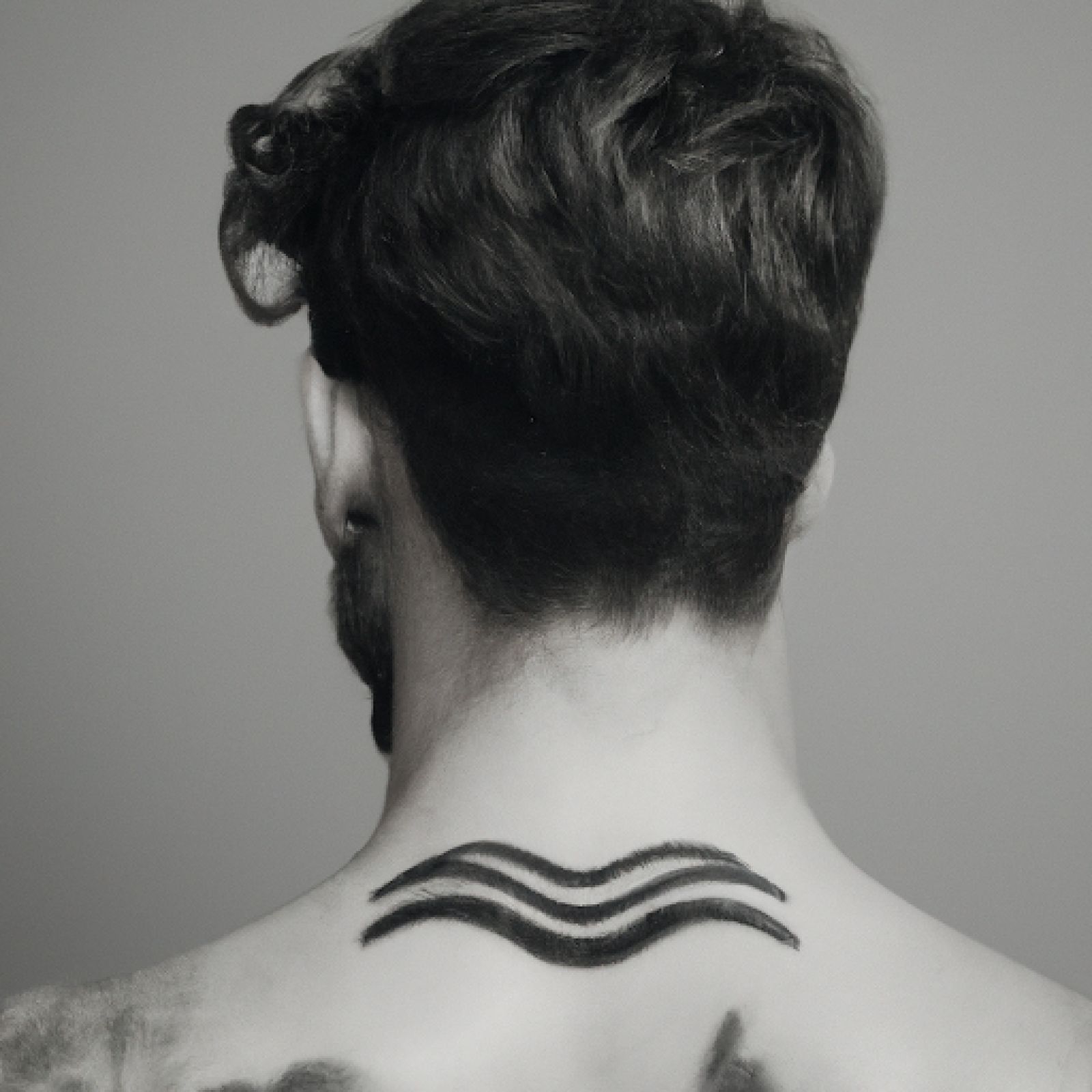 Wave tattoo on side for men