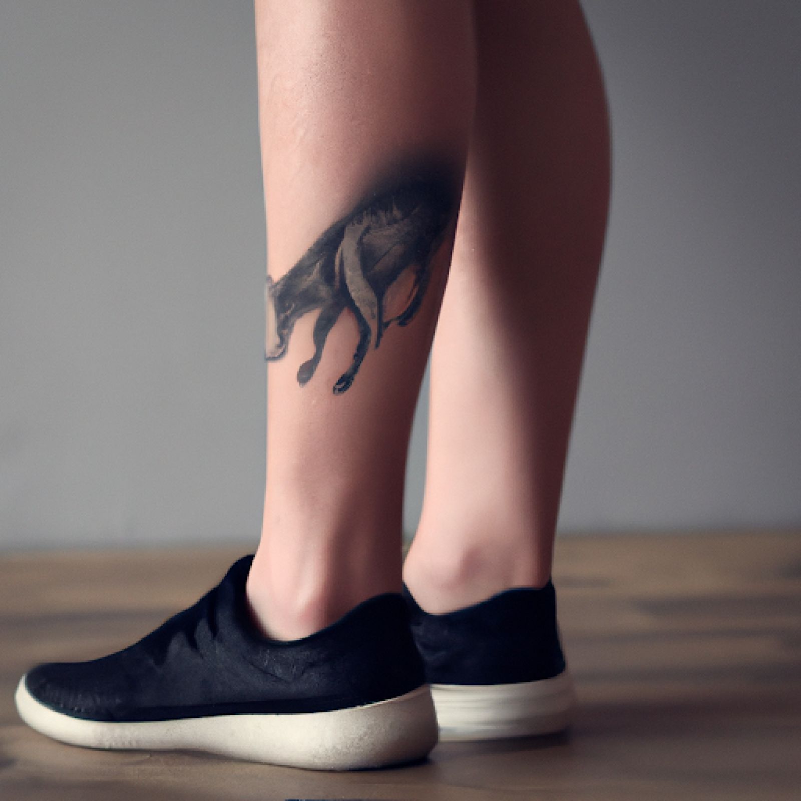 Wolf tattoo on leg for women