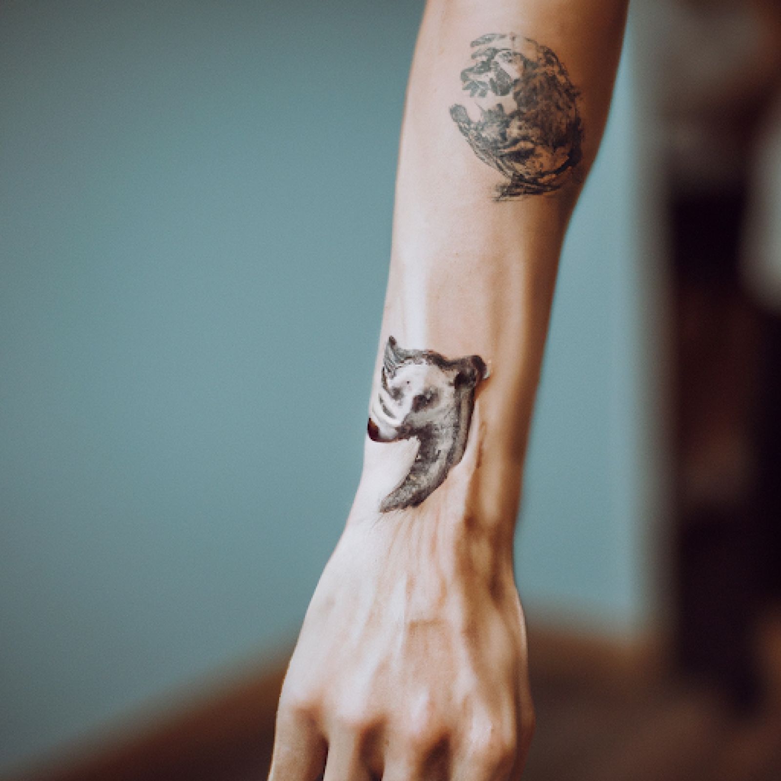 Wolf tattoo on wrist for men