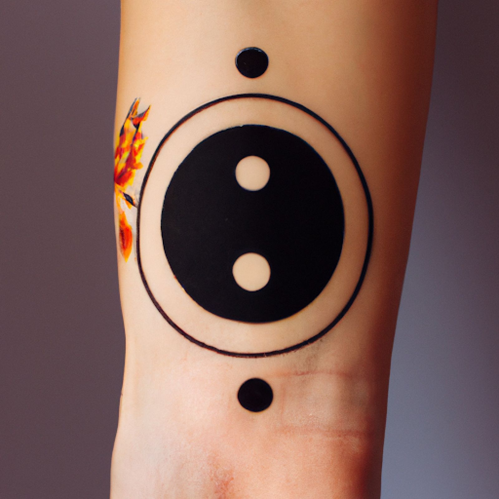 Yin yang tattoo on arm for women