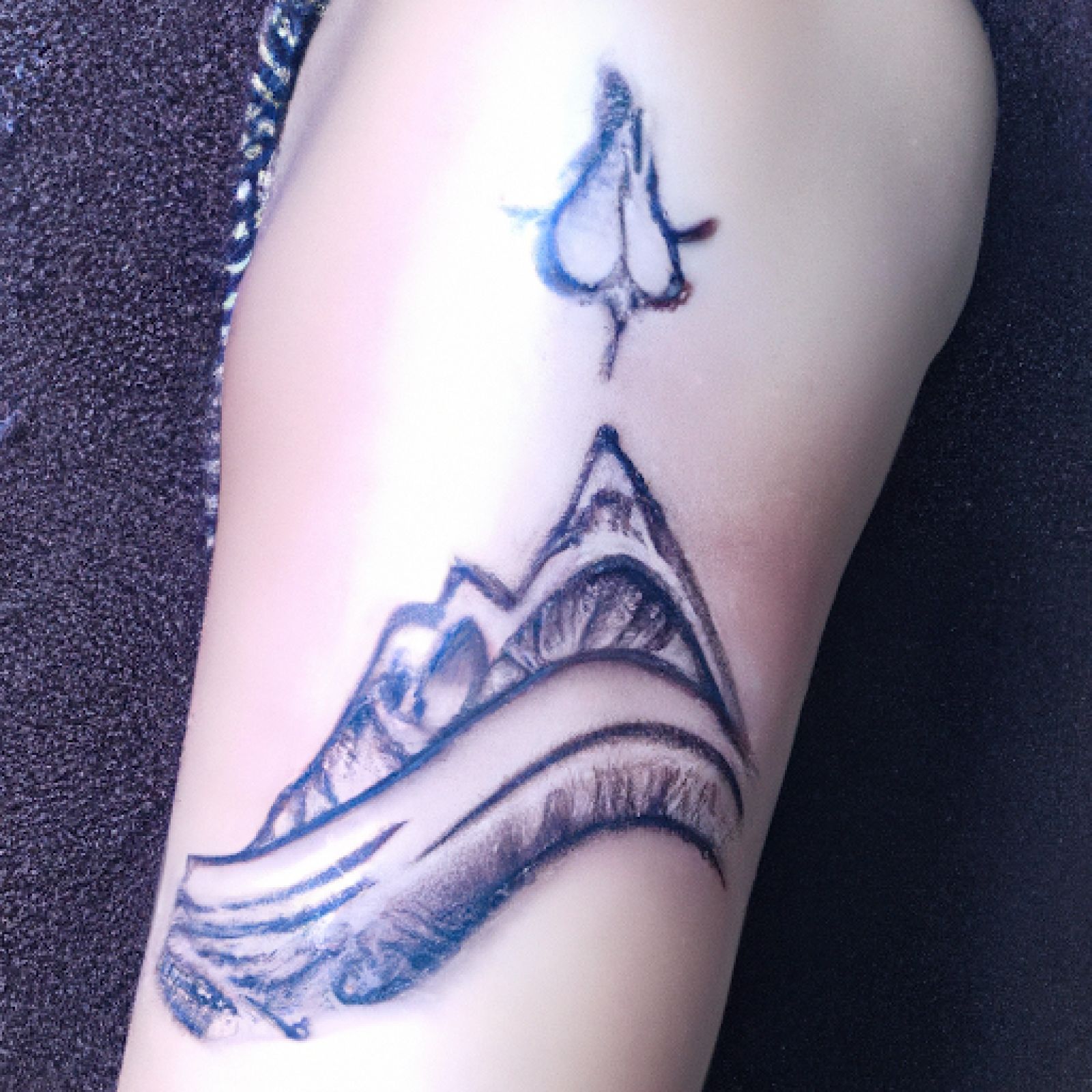 Mountain tattoo on arm for women