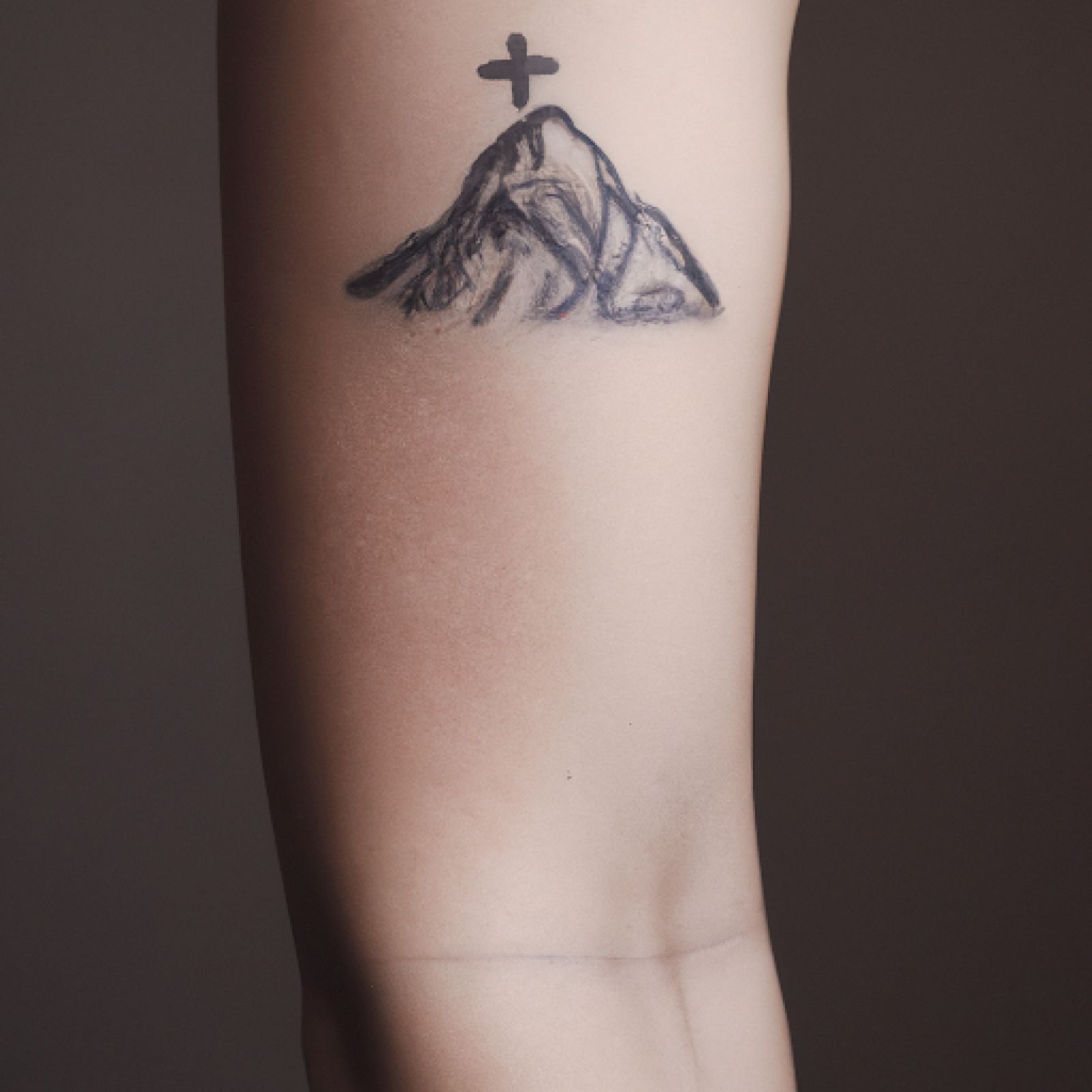 Mountain tattoo on forearm for women