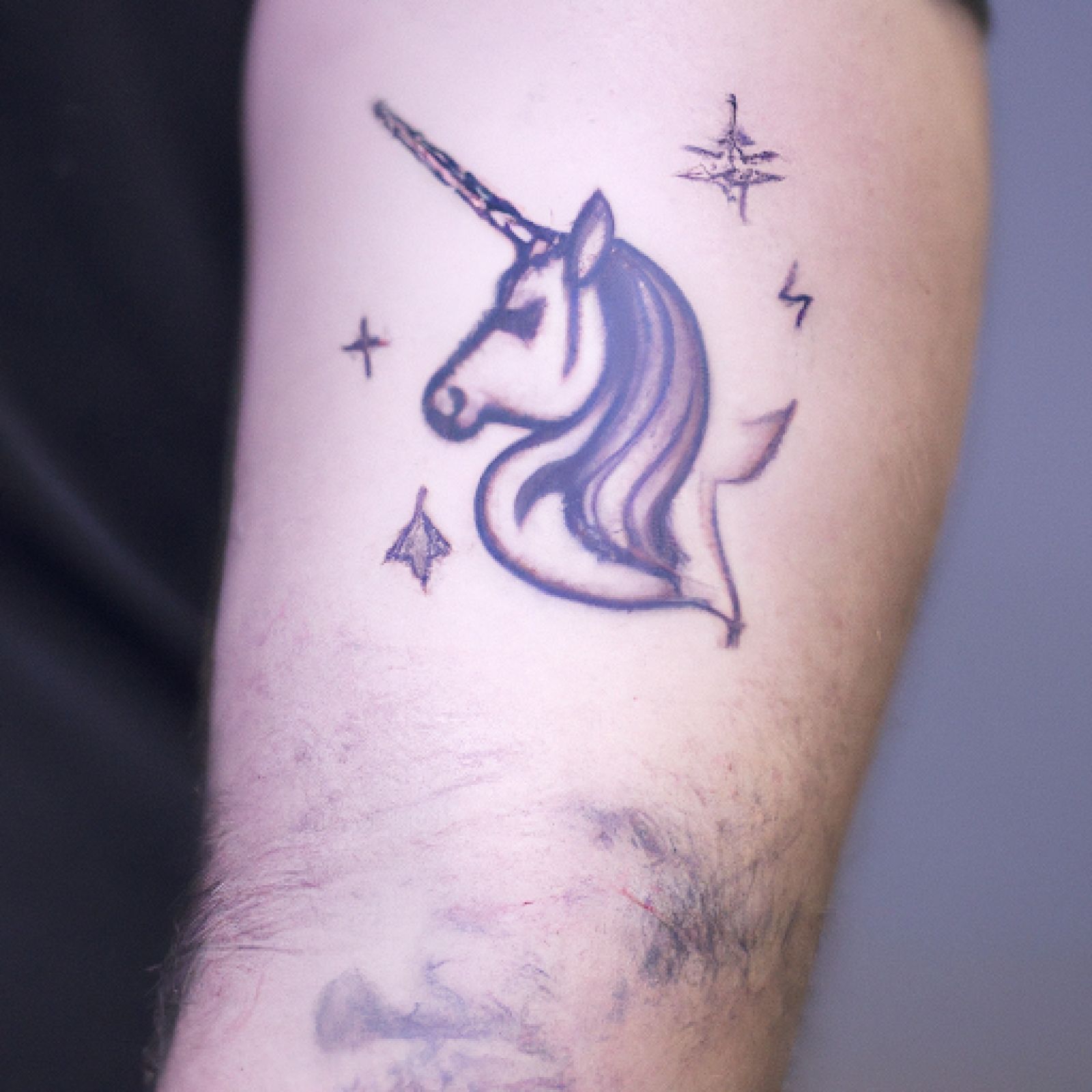 Unicorn tattoo on arm for men