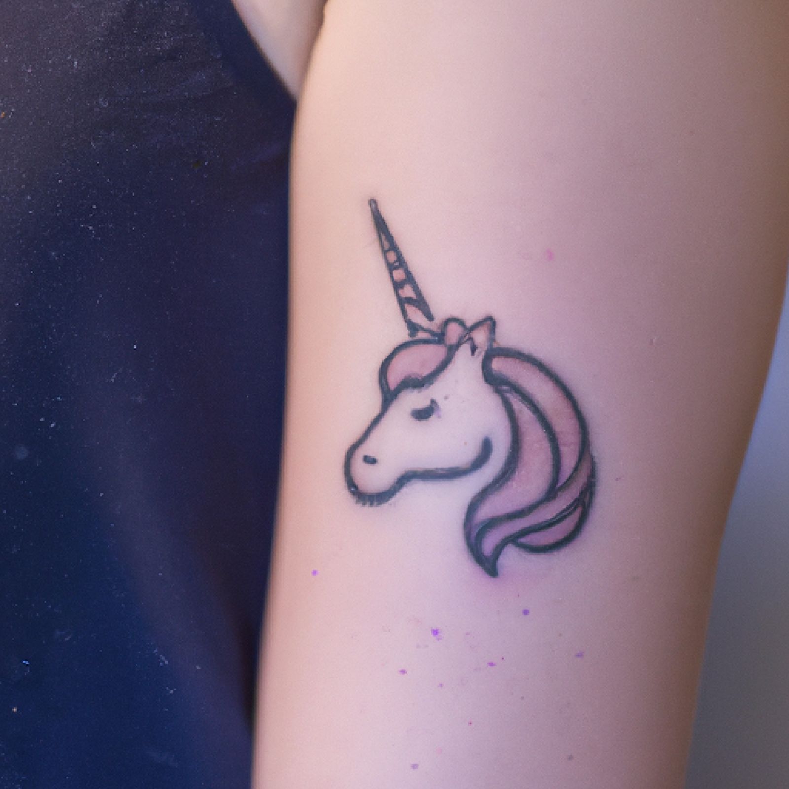 Unicorn tattoo on arm for women