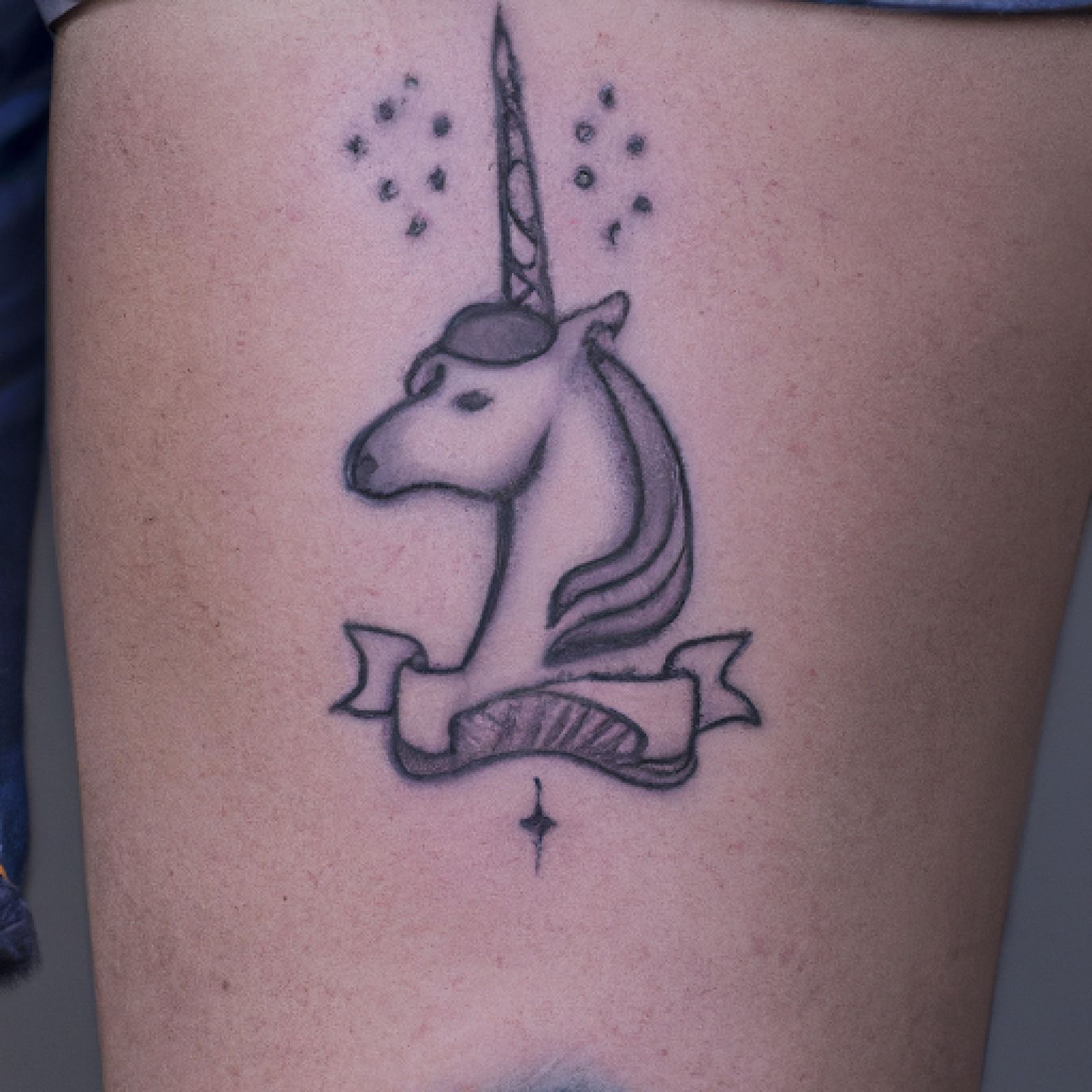 Unicorn tattoo on calf for men