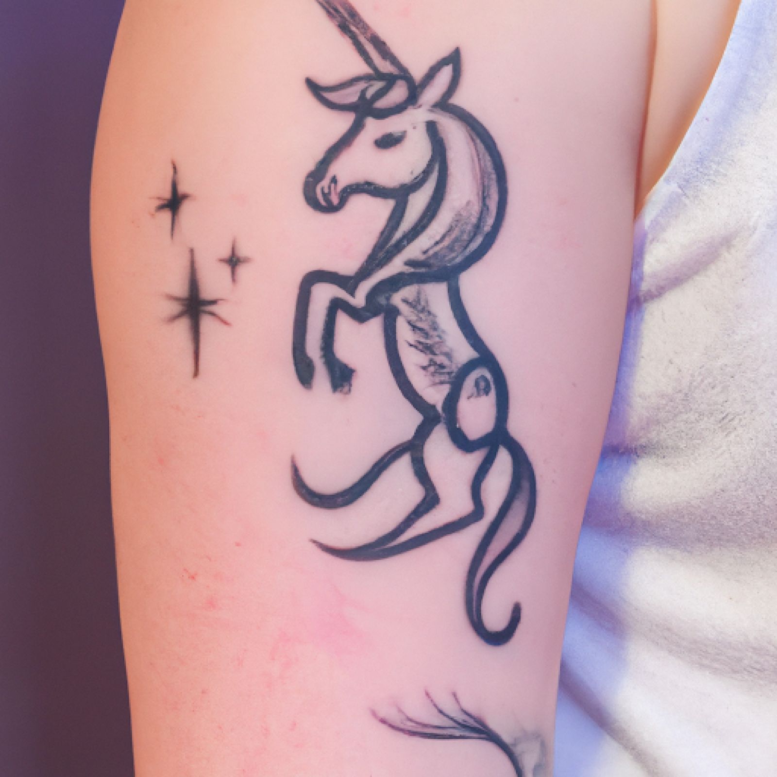 Unicorn tattoo on forearm for women