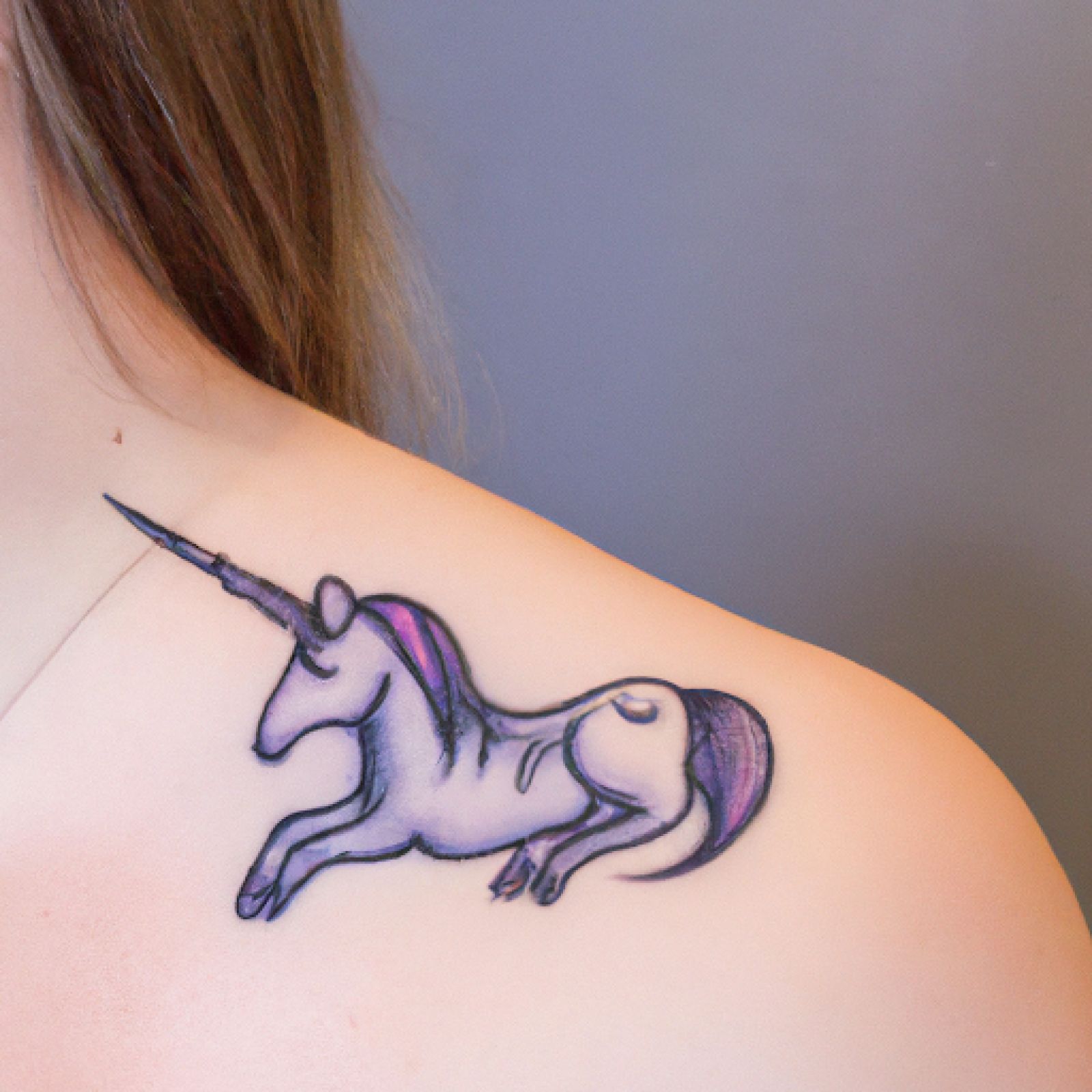 Unicorn tattoo on shoulder for women