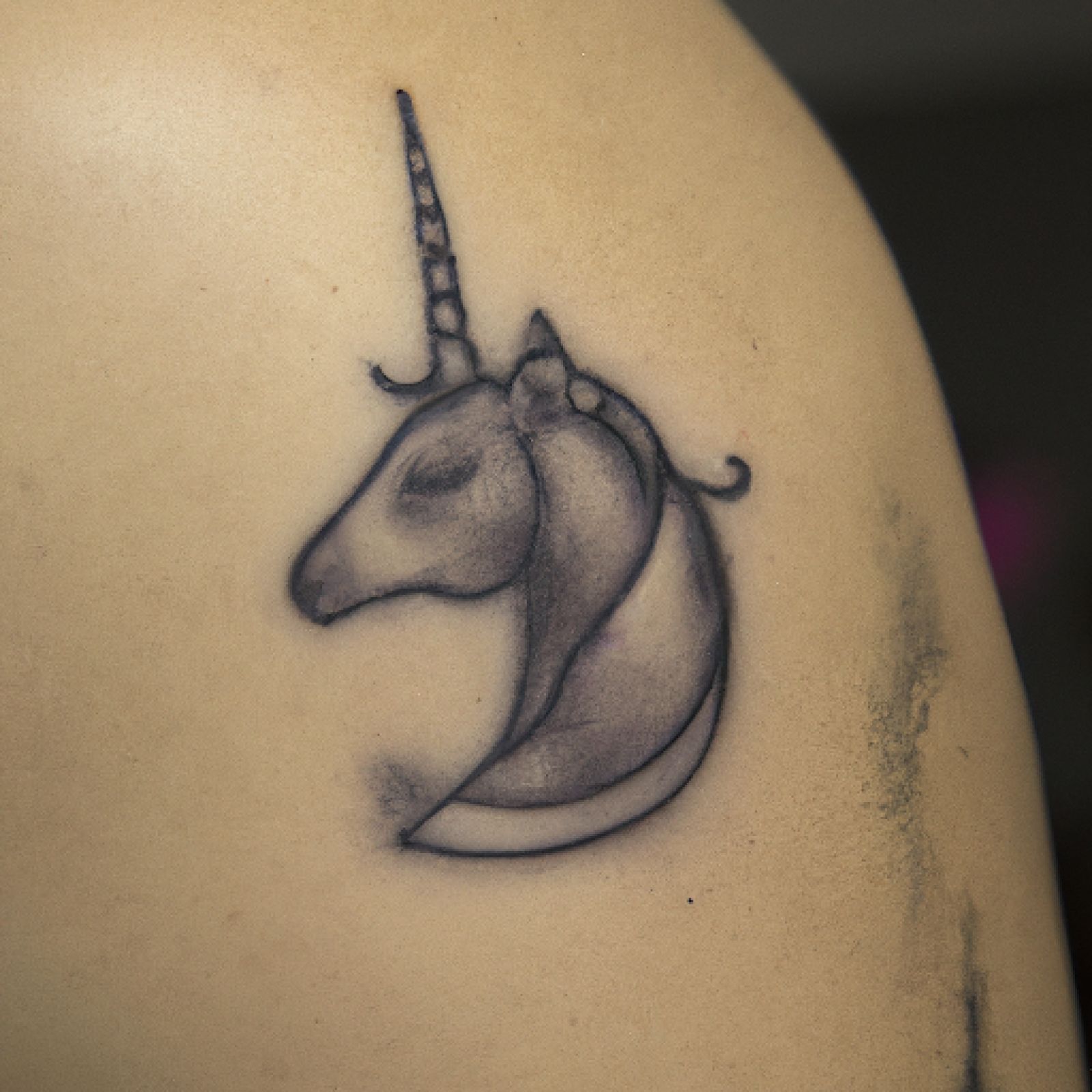 Unicorn tattoo on side for men