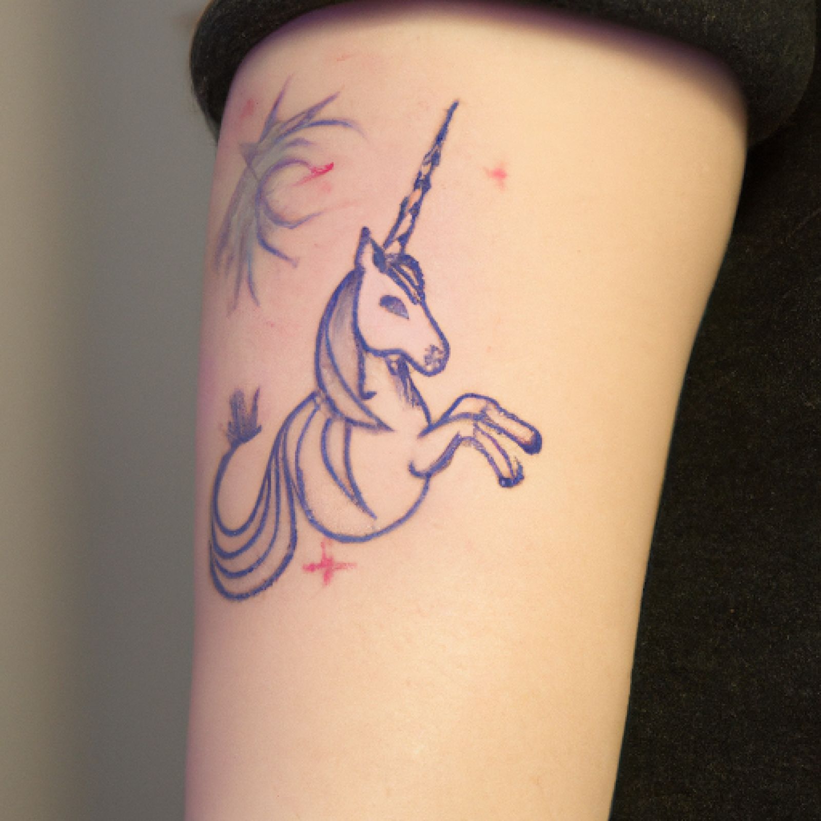 Unicorn tattoo on sleeve for women